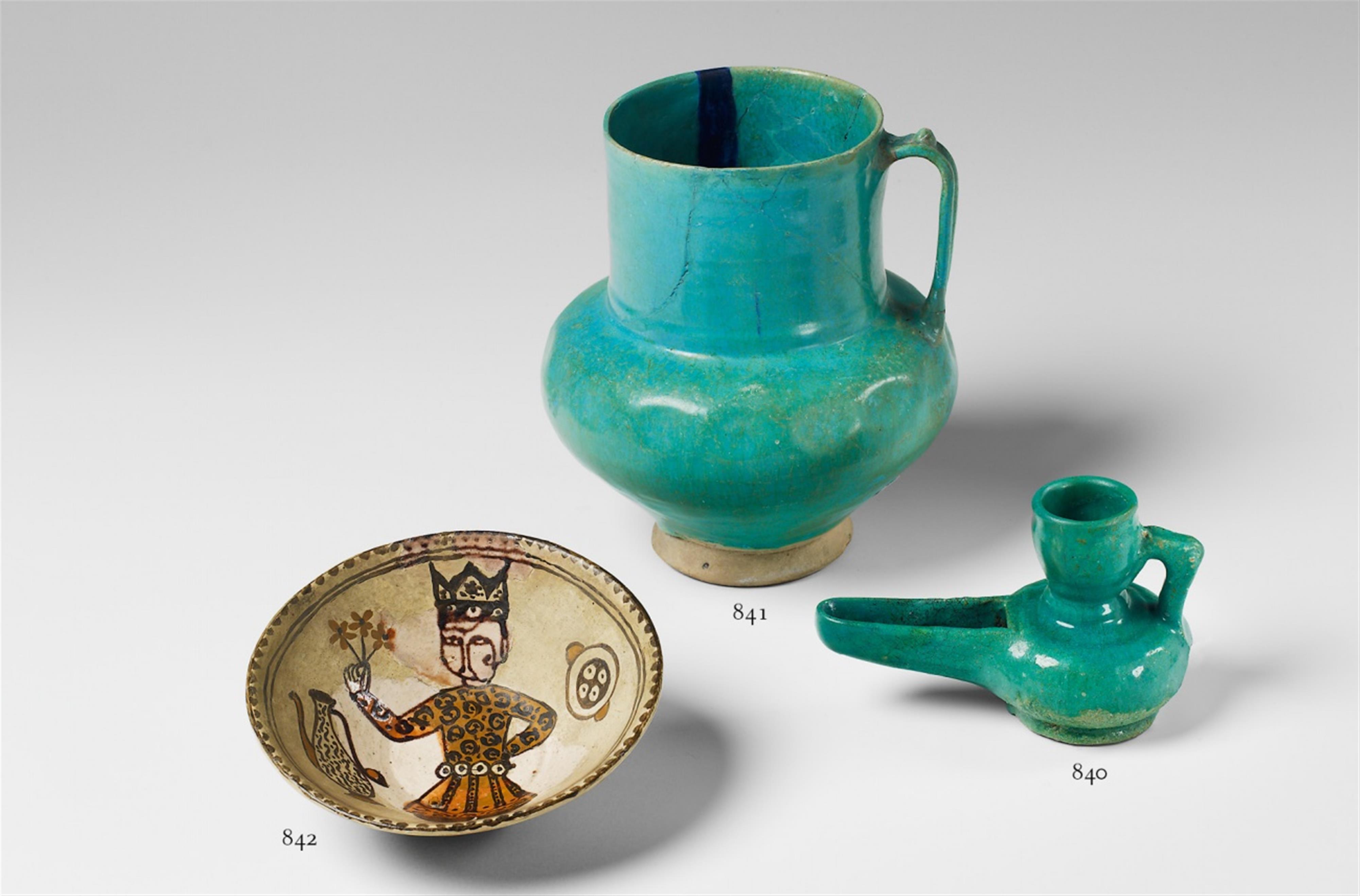 An Iranian turquoise glazed ceramic pitcher. - image-1