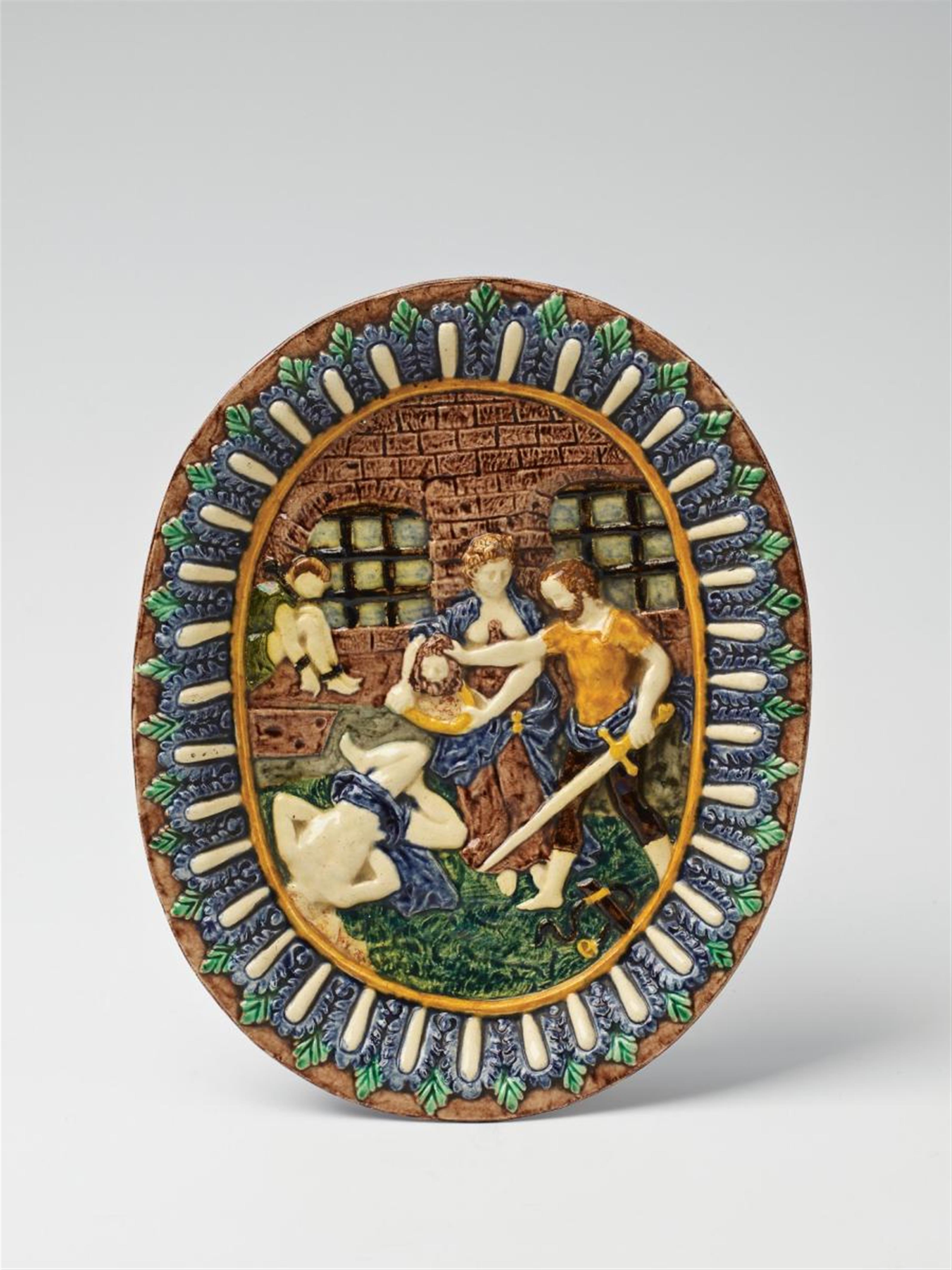 A French maiolica dish with a relief depiction of the martyrdom of John the Baptist. - image-1