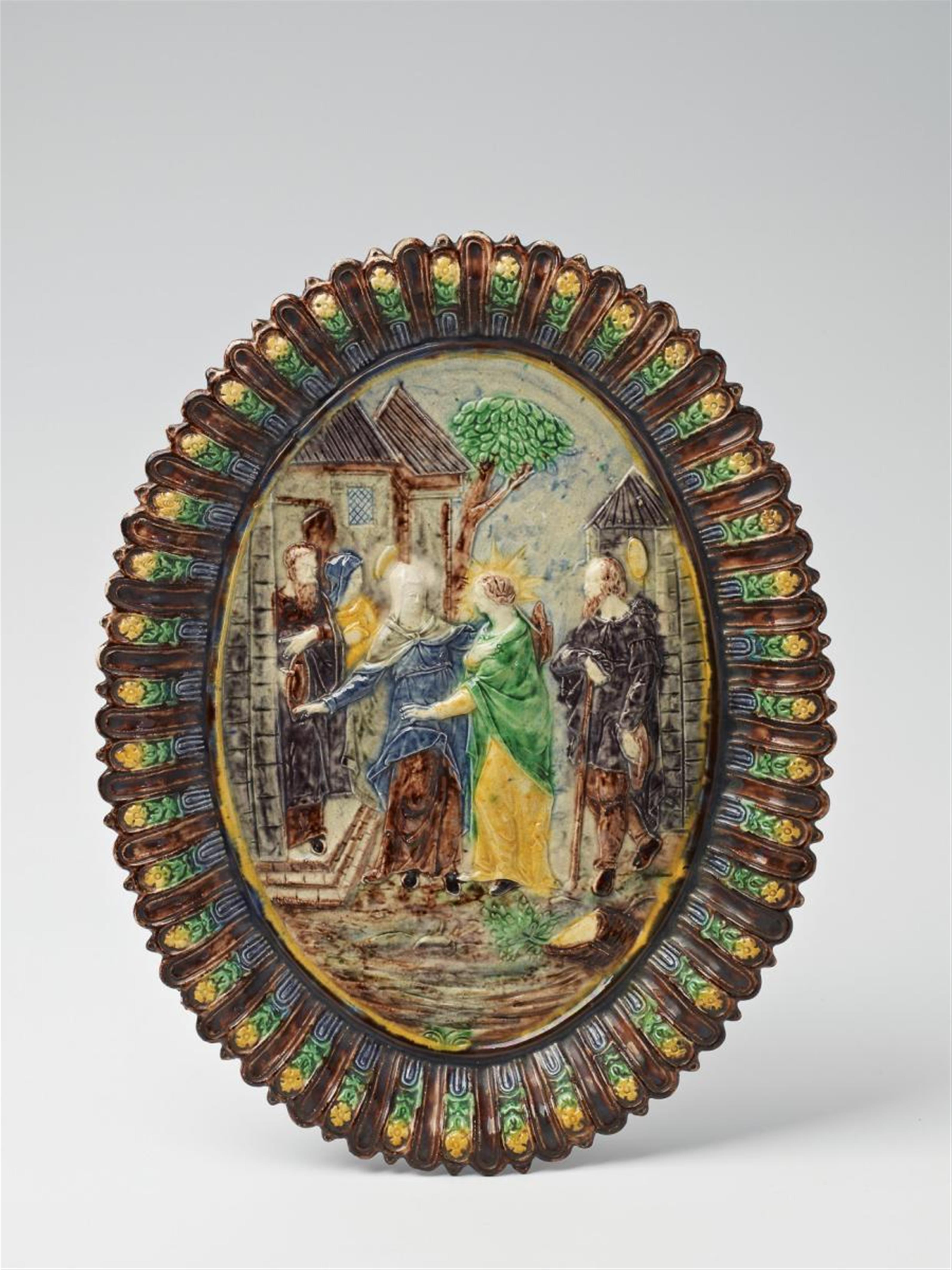 A French maiolica platter with a relief of the Visitation. - image-1