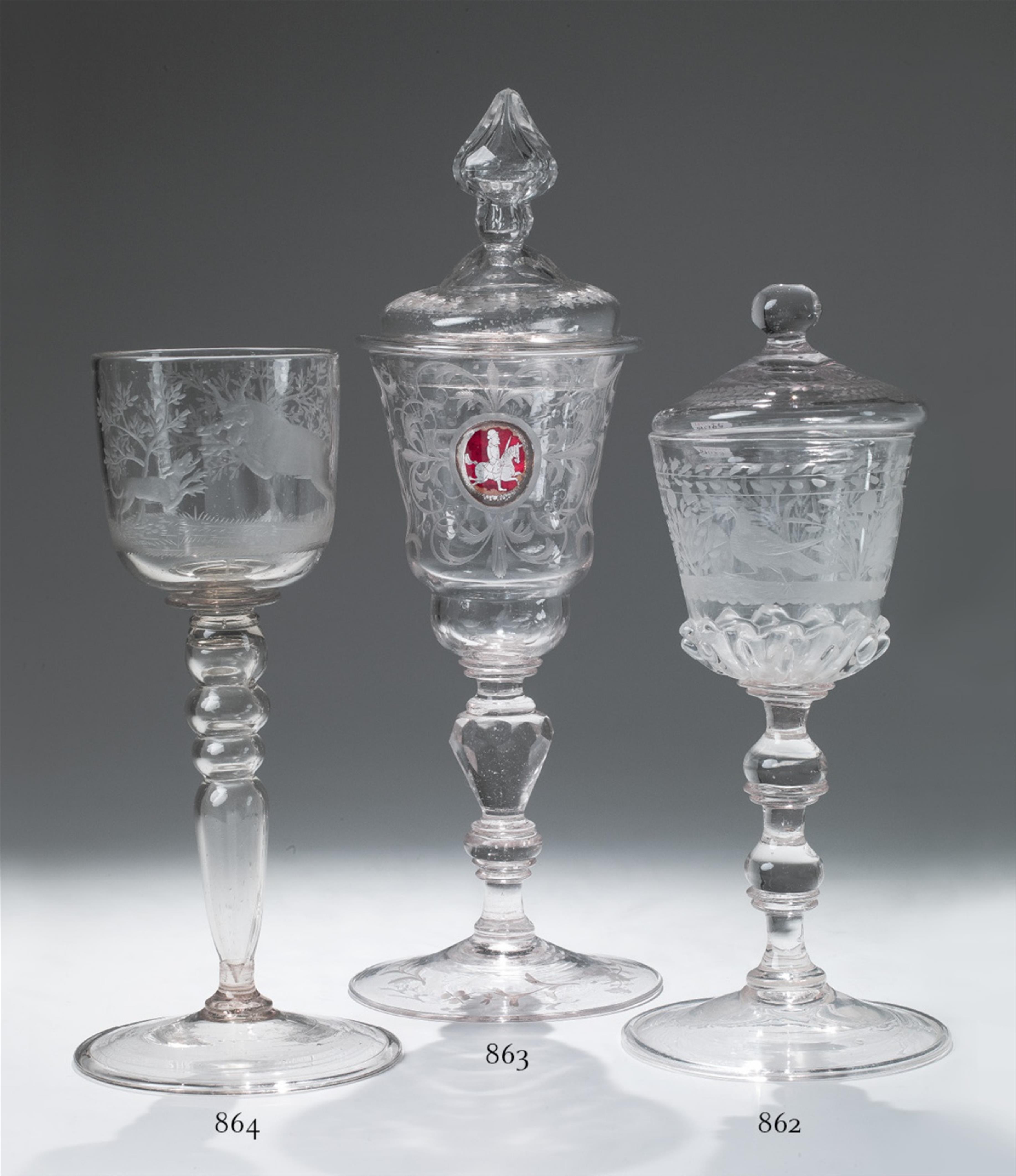 A clear cut glass goblet decorated with a jumping bull. - image-1