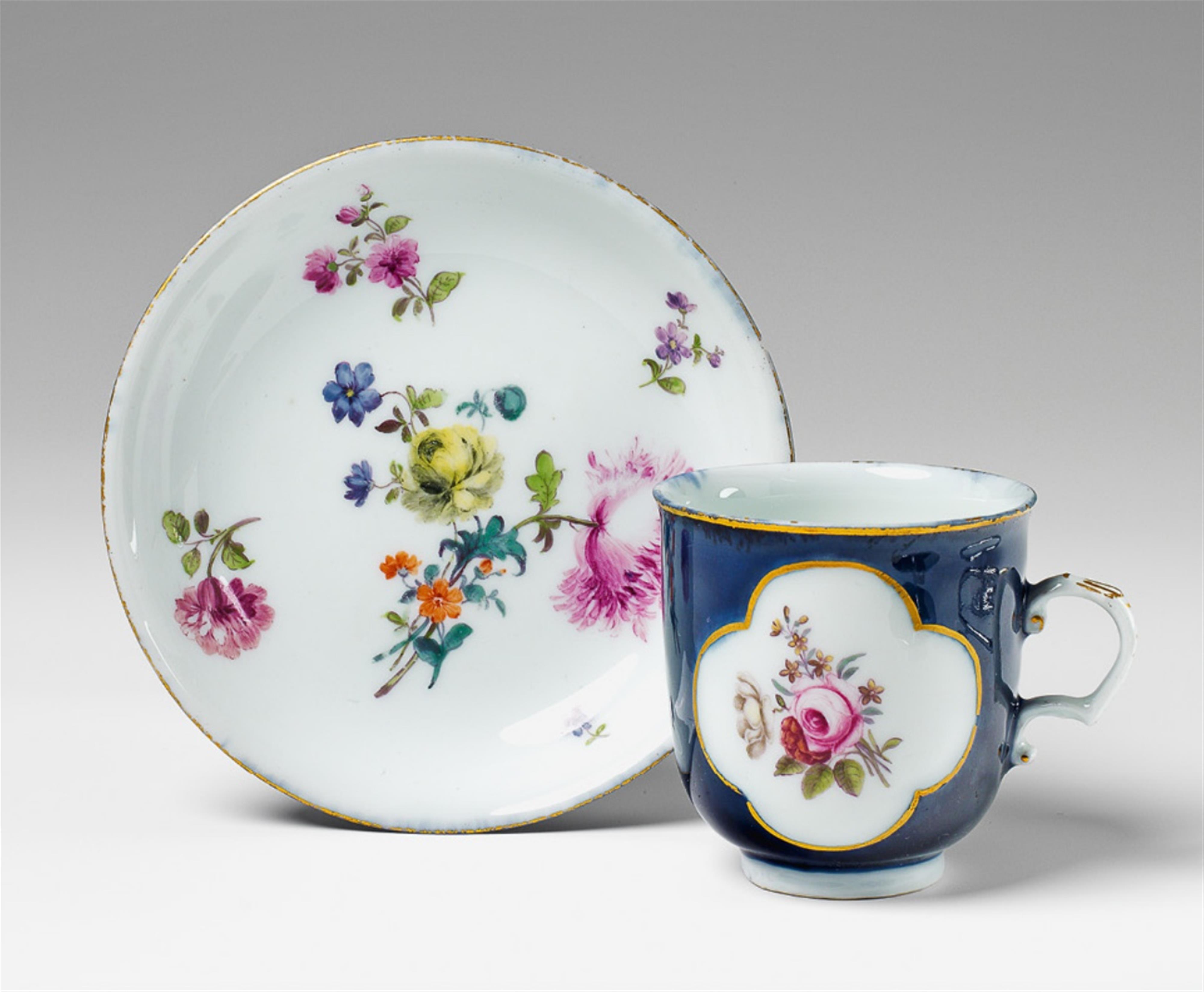 A Meissen porcelain hot chocolate cup and saucer with a dark blue ground. - image-1