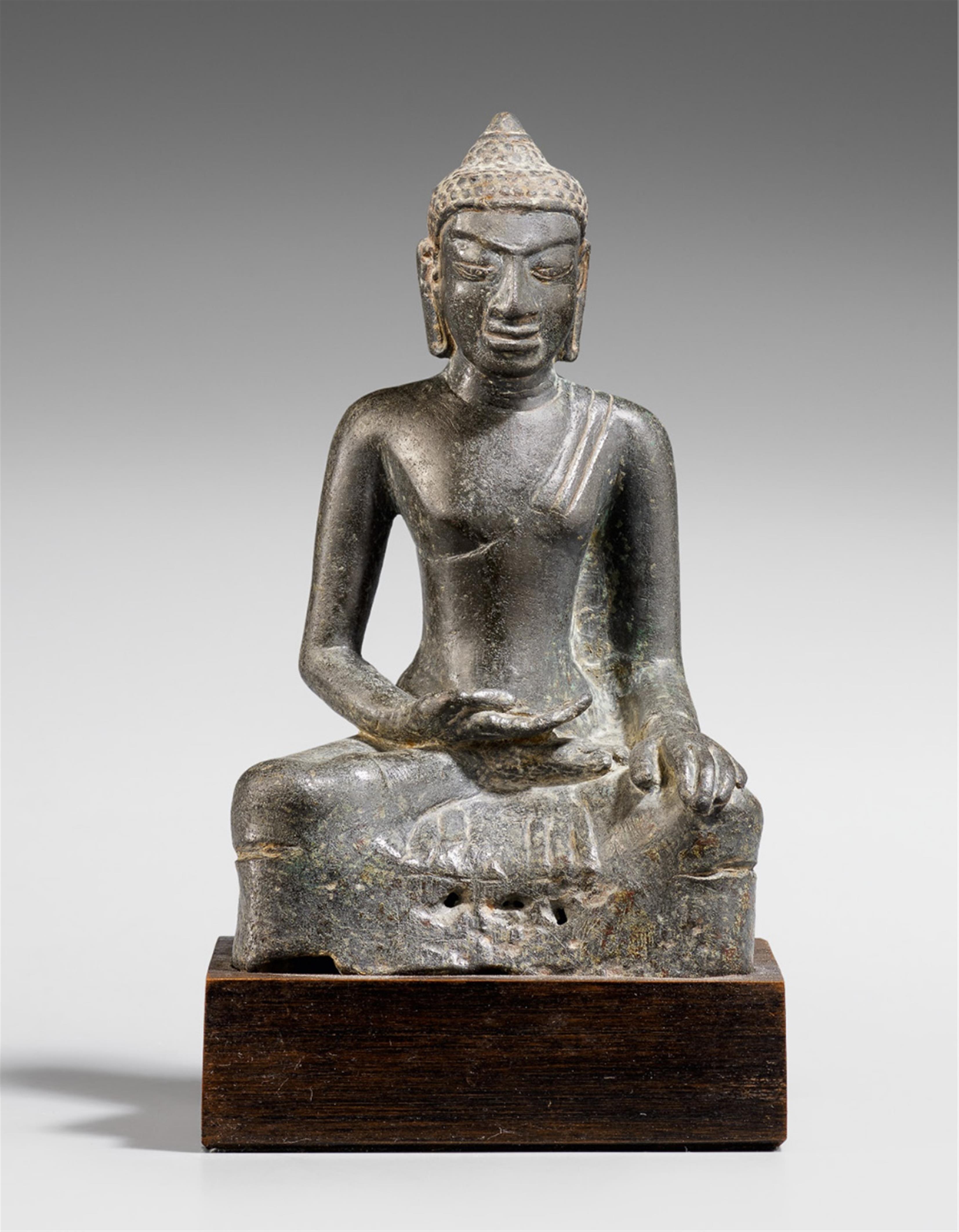 A Mon-Dvaravati-style bronze or tin alloy figure of a Buddha - image-1