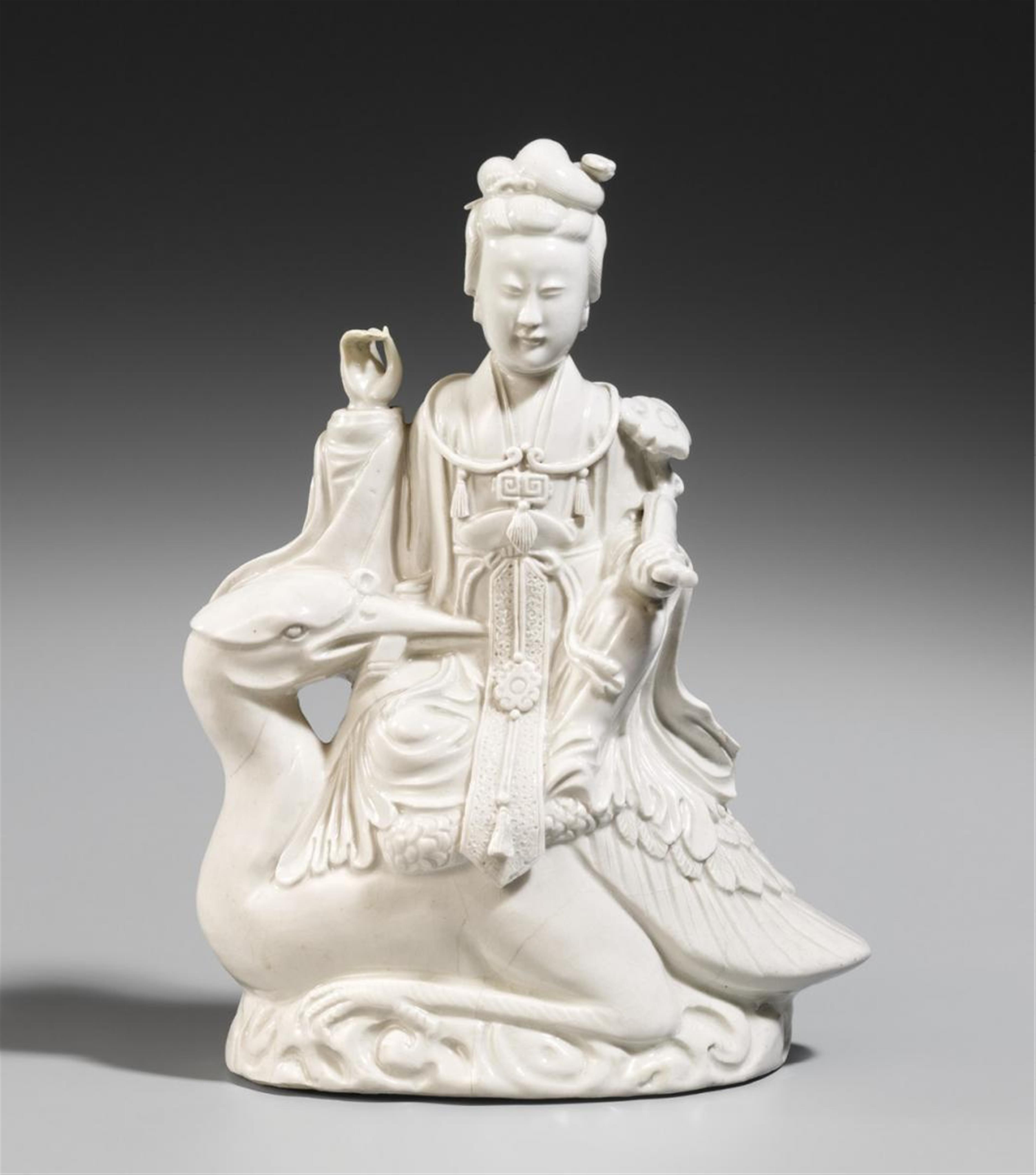 A blanc-de-Chine figure of a female deity sitting on a crane. Dehua. 20th century - image-1