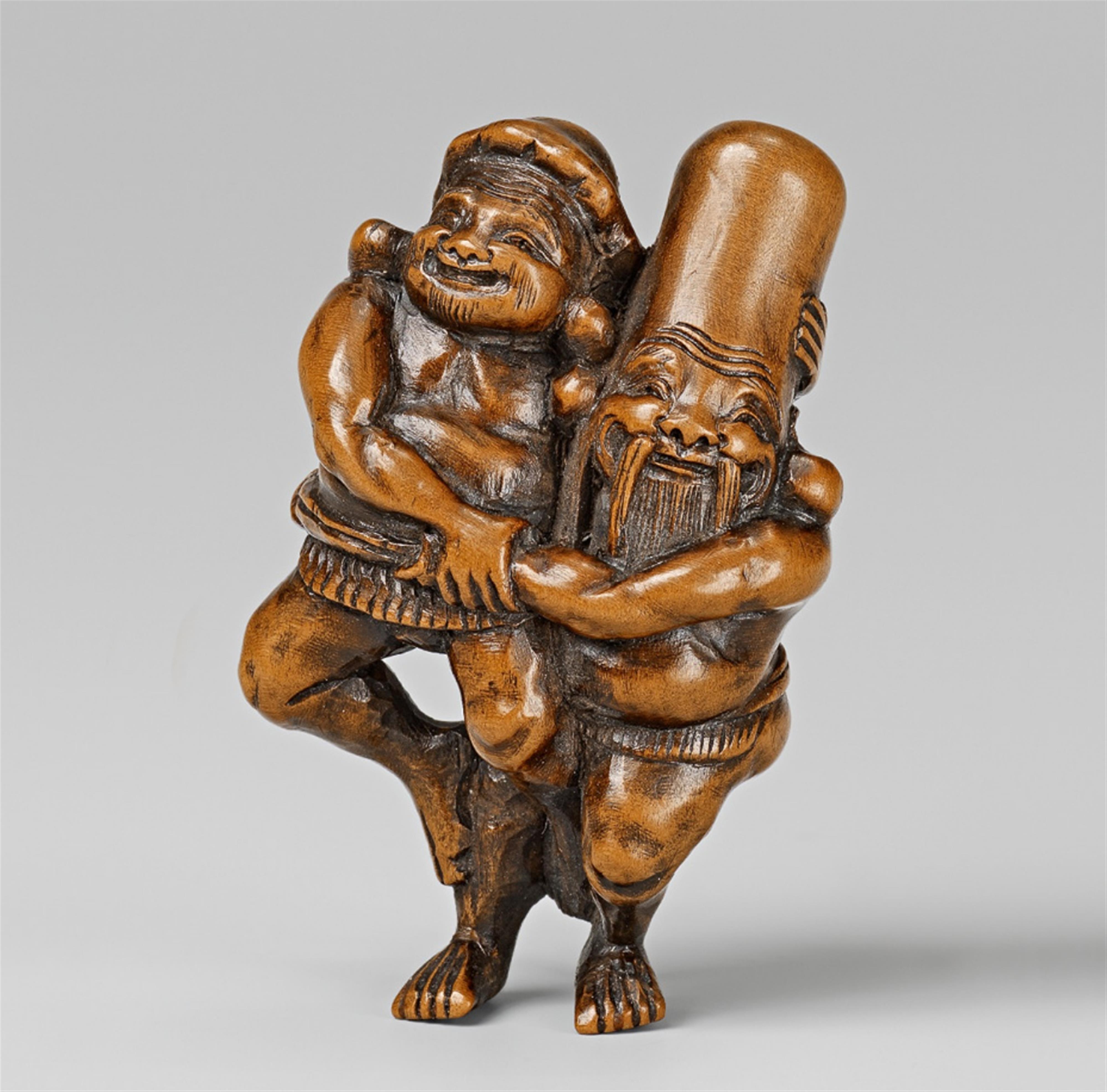 A small boxwood netsuke of Fukurokuju and Daikoku as wrestlers, by Masatomo. 19th century - image-1