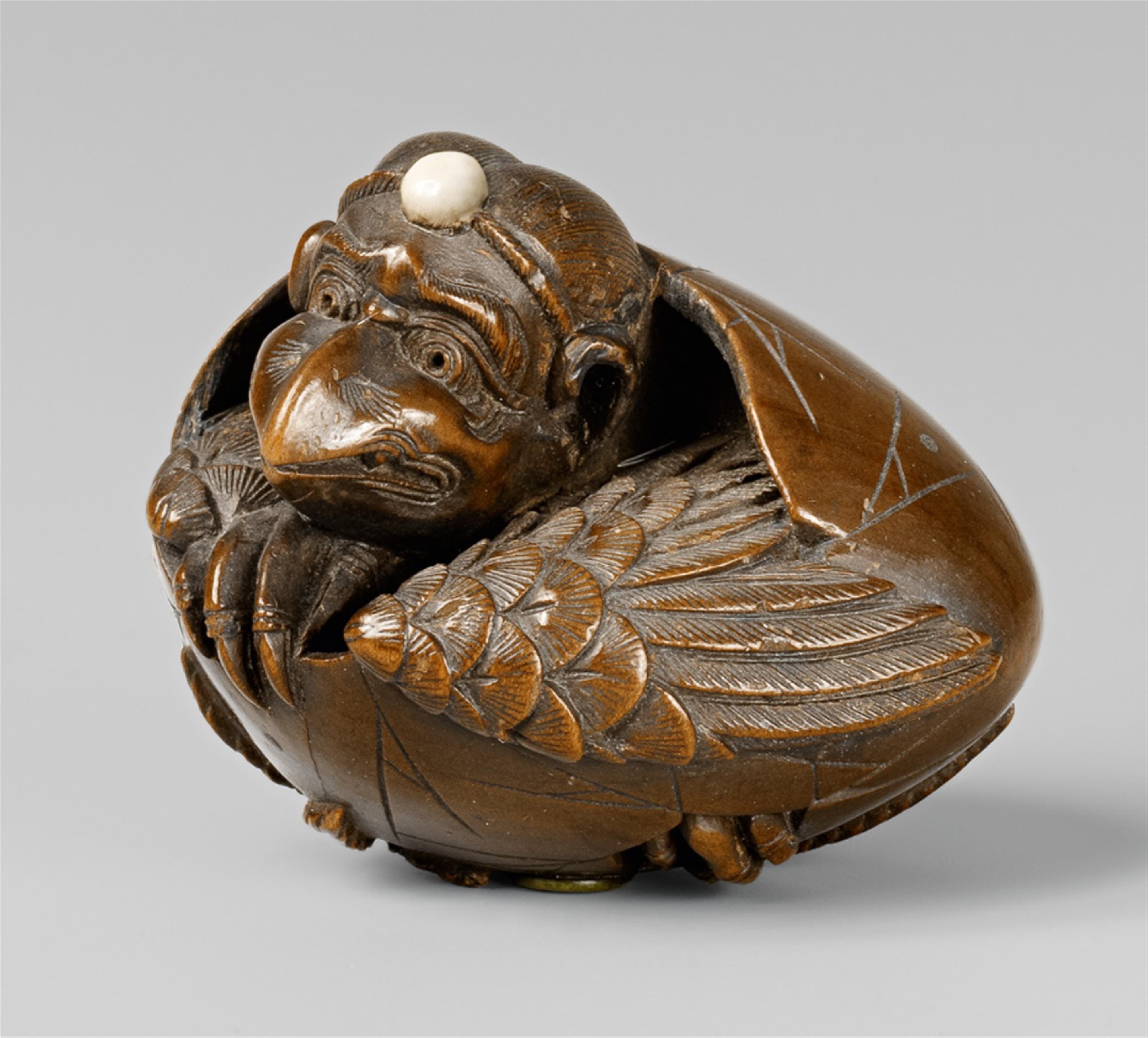 A fine Edo school boxwood netsuke of a karasu tengu hatching from an egg, by Shûmin. Mid-19th century - image-1