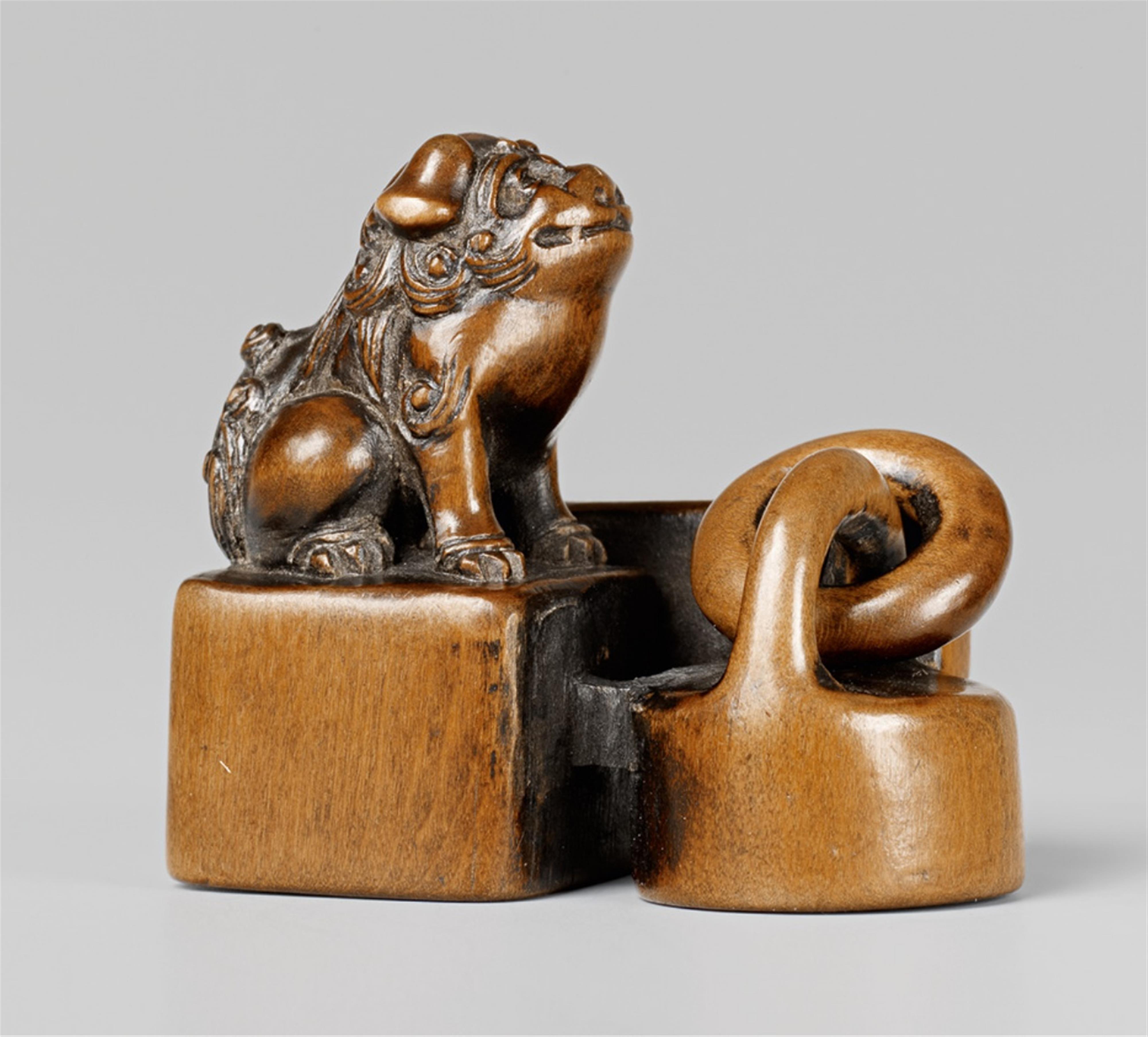 A boxwood netsuke of a group of seals. 19th century - image-1