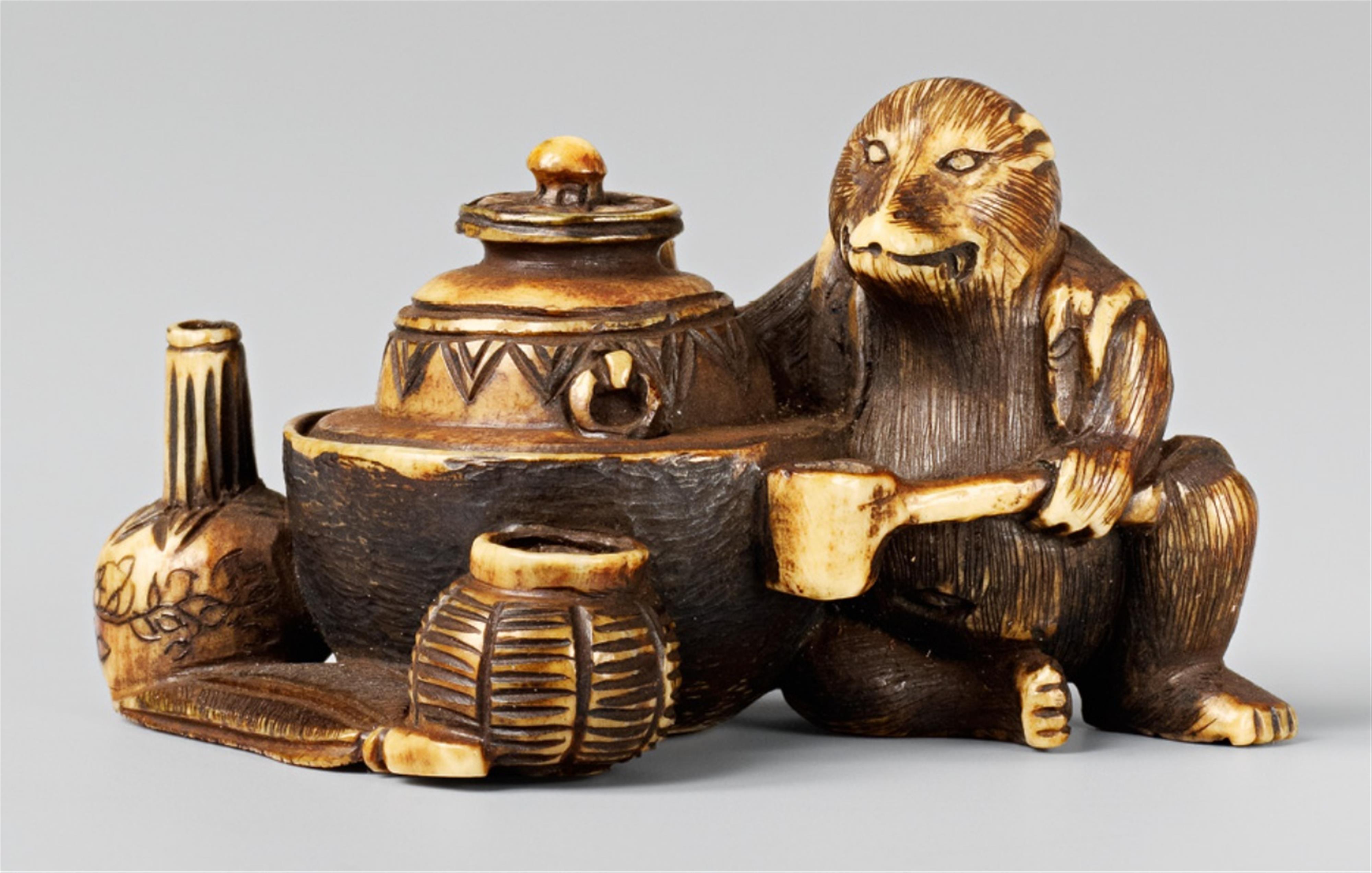 An ivory netsuke of a tanuki preparing tea, by Shigemasa. Late 19th century - image-1