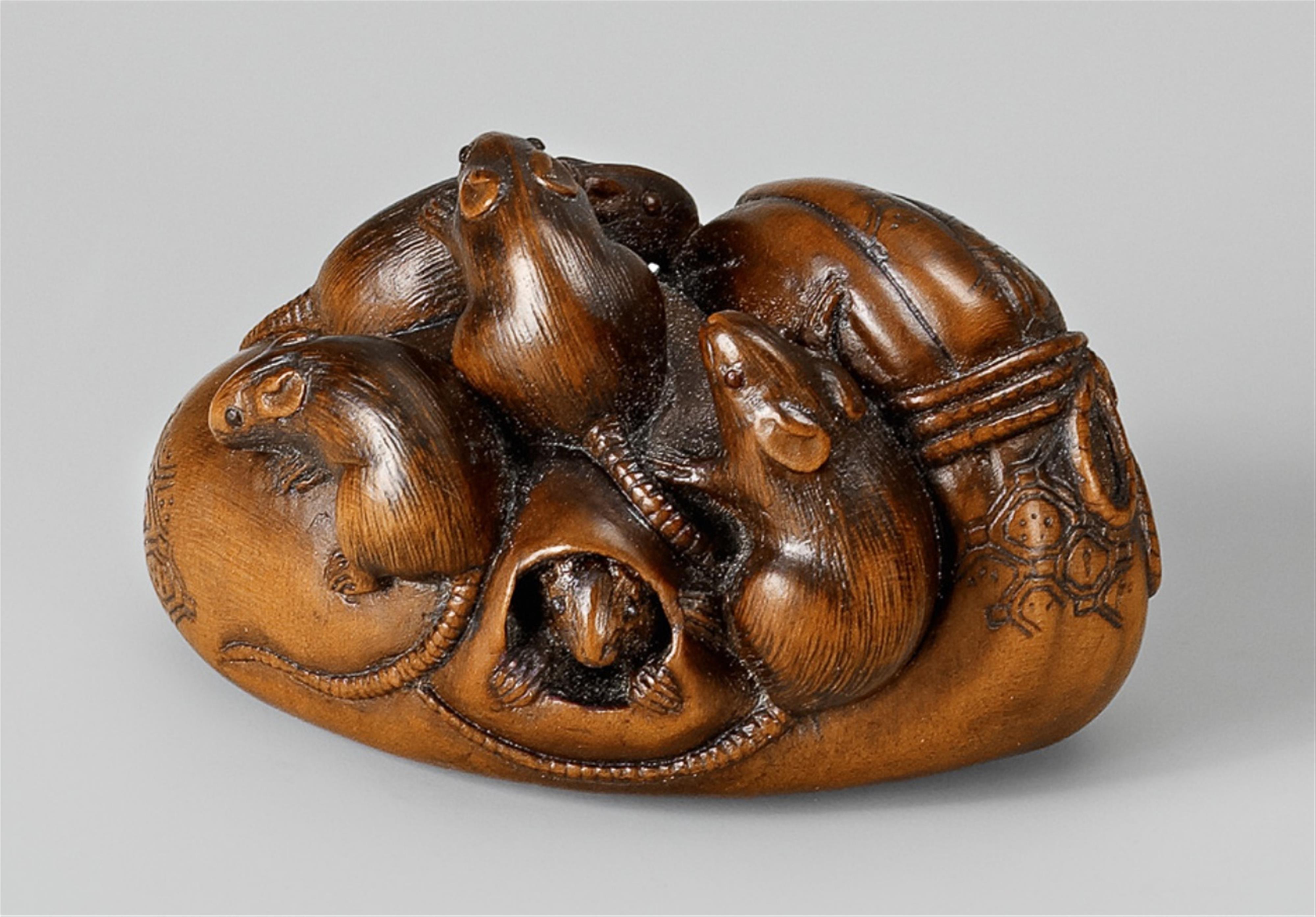 A boxwood netsuke of seven rats in and around a takara bukuro. Mid-19th century - image-1