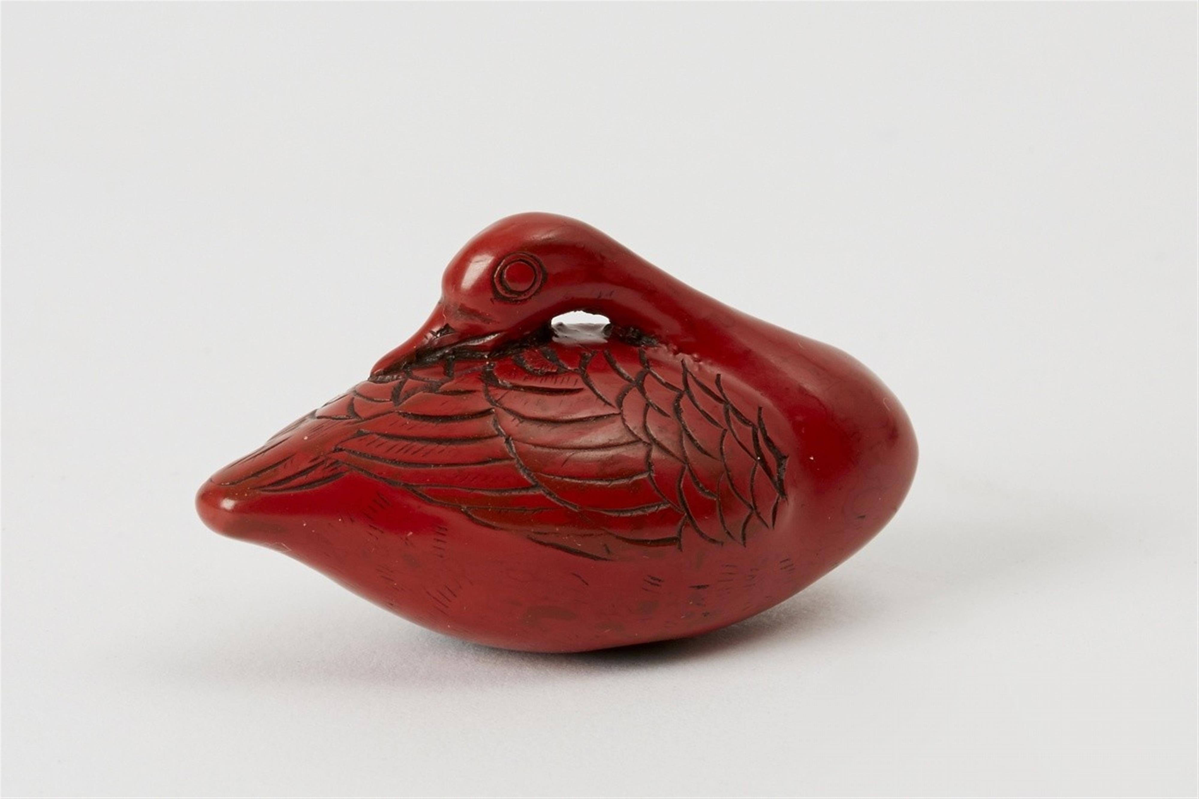 A small ivory netsuke of a dog and a red lacquer wood netsuke. First half 19th century - image-2