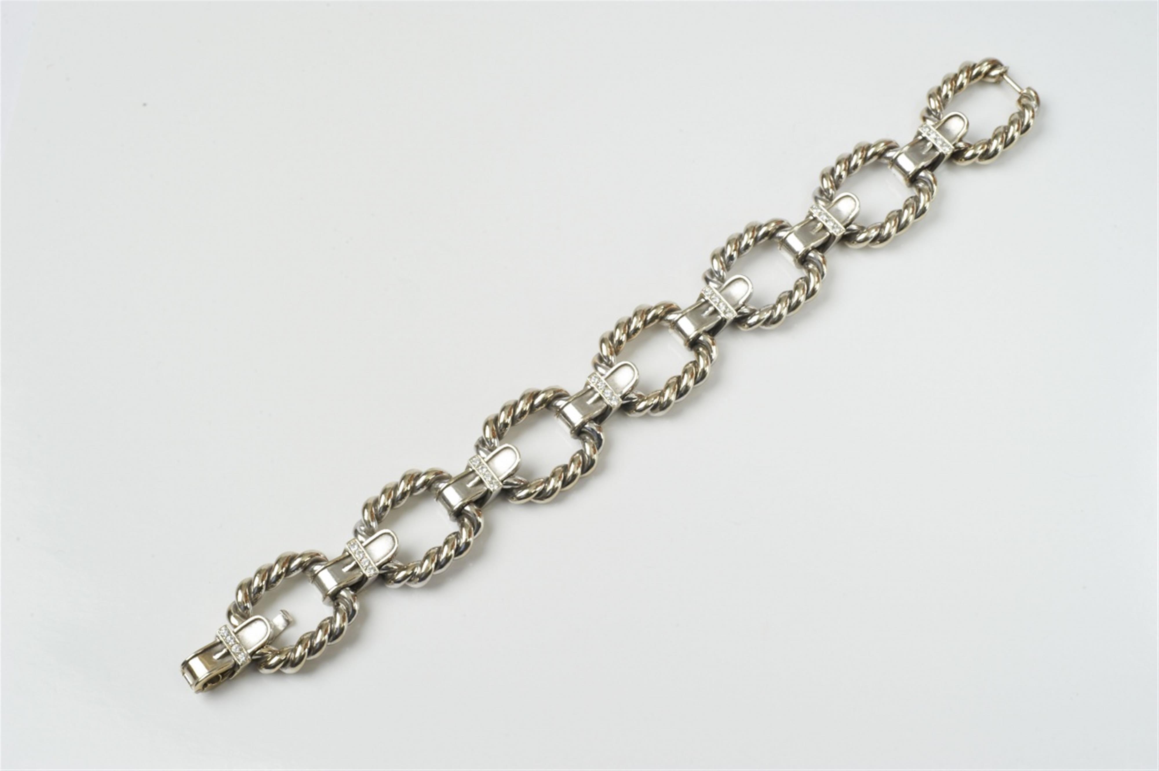 An 18k white gold and diamond link bracelet - image-1