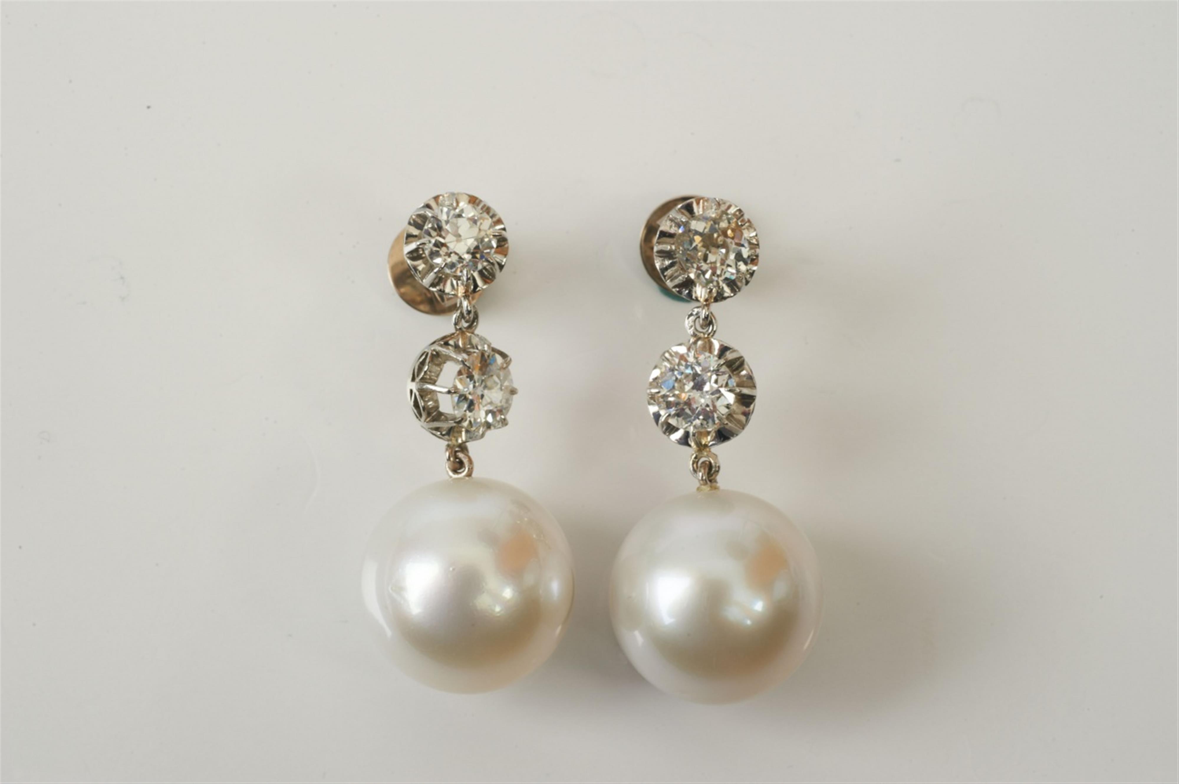 A pair of 14k gold, diamond and South Sea pearl earrings - image-1