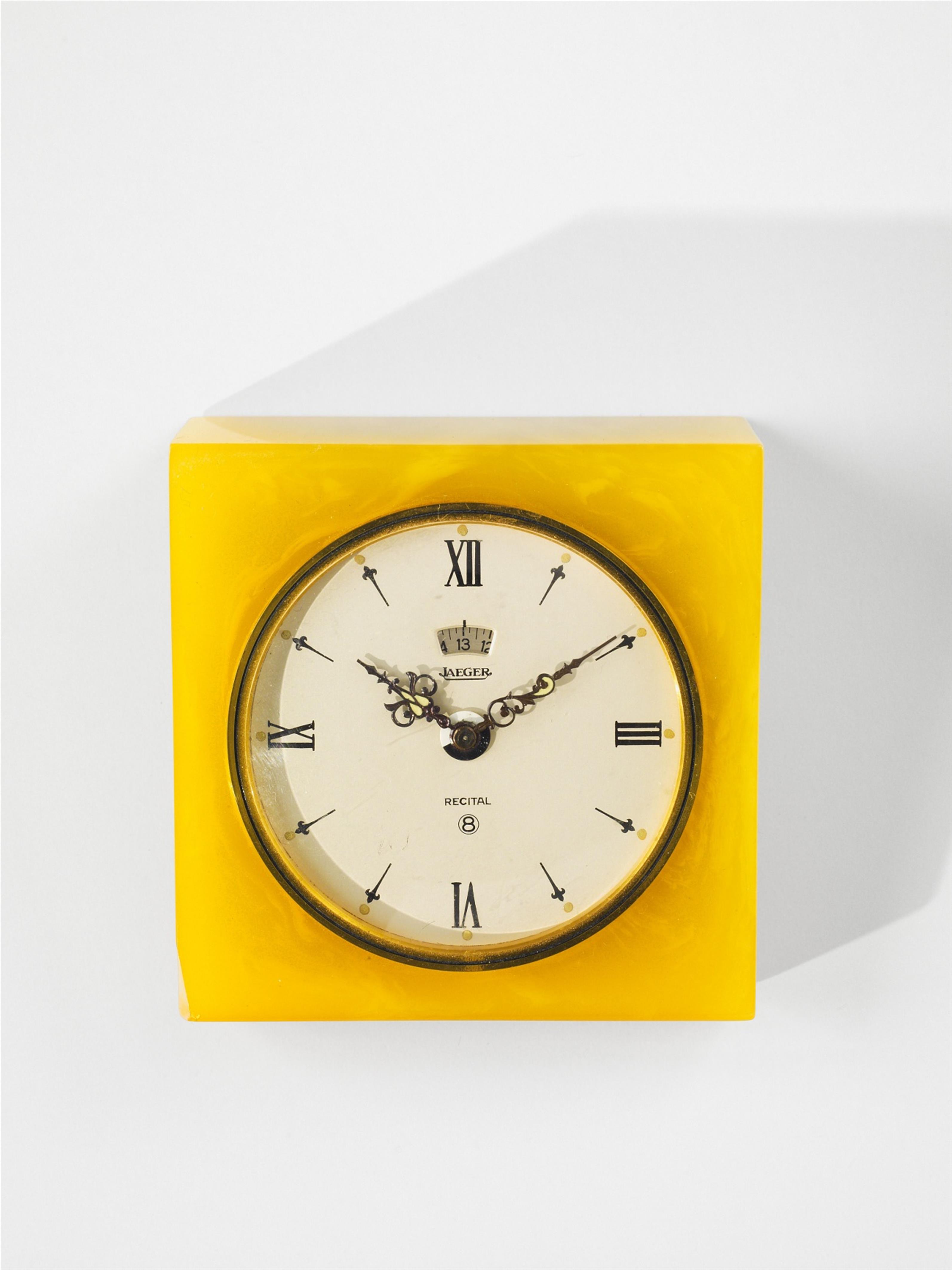 A Jaeger Le Coultre gilt metal and marble-effect bakelite table alarm clock - image-1