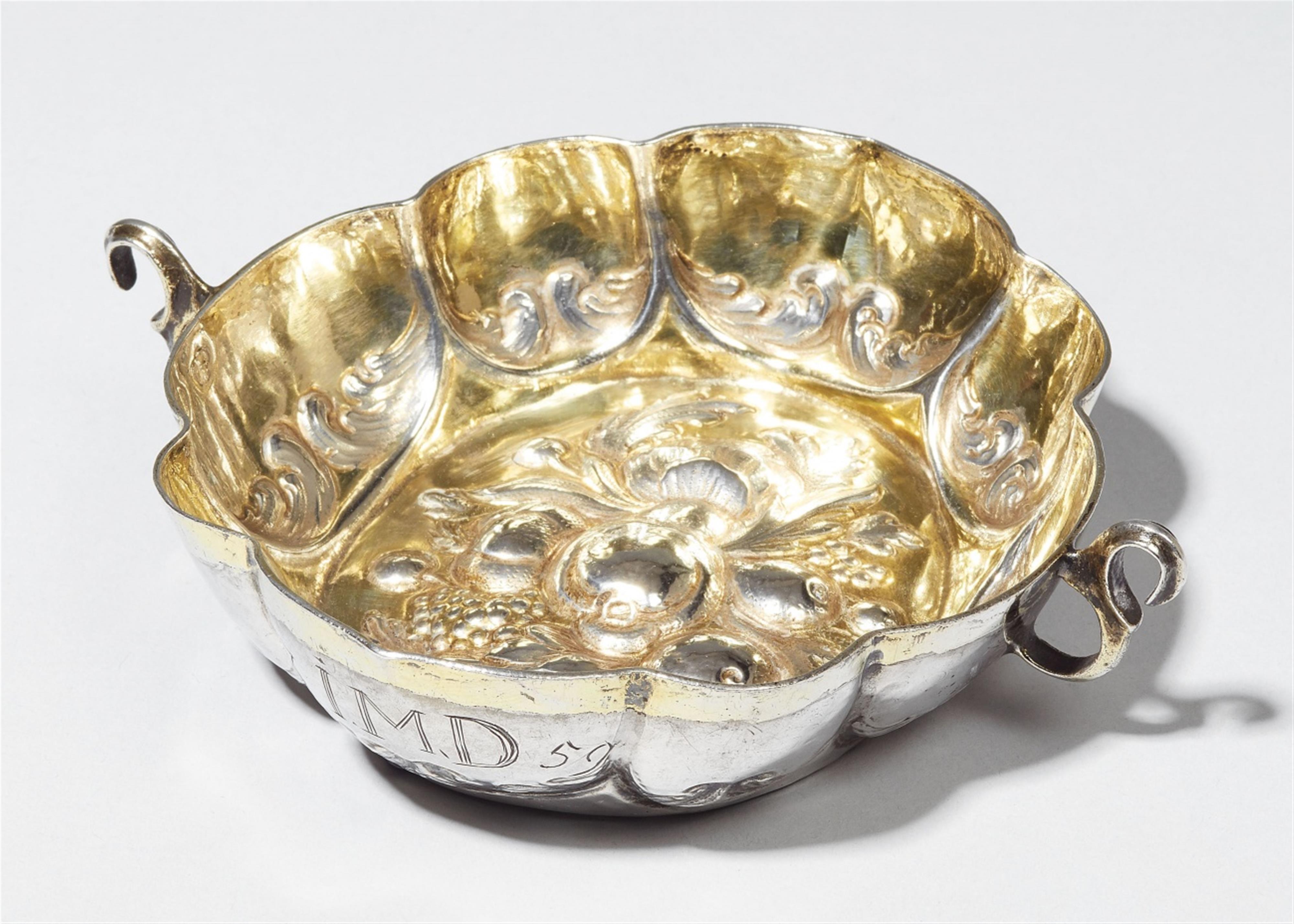 A Nuremberg partially gilt silver brandy bowl. With presumably later monograms "iAMG" and "iMD", dated 1759. Indistinct maker's mark, 1688 - 92. - image-1