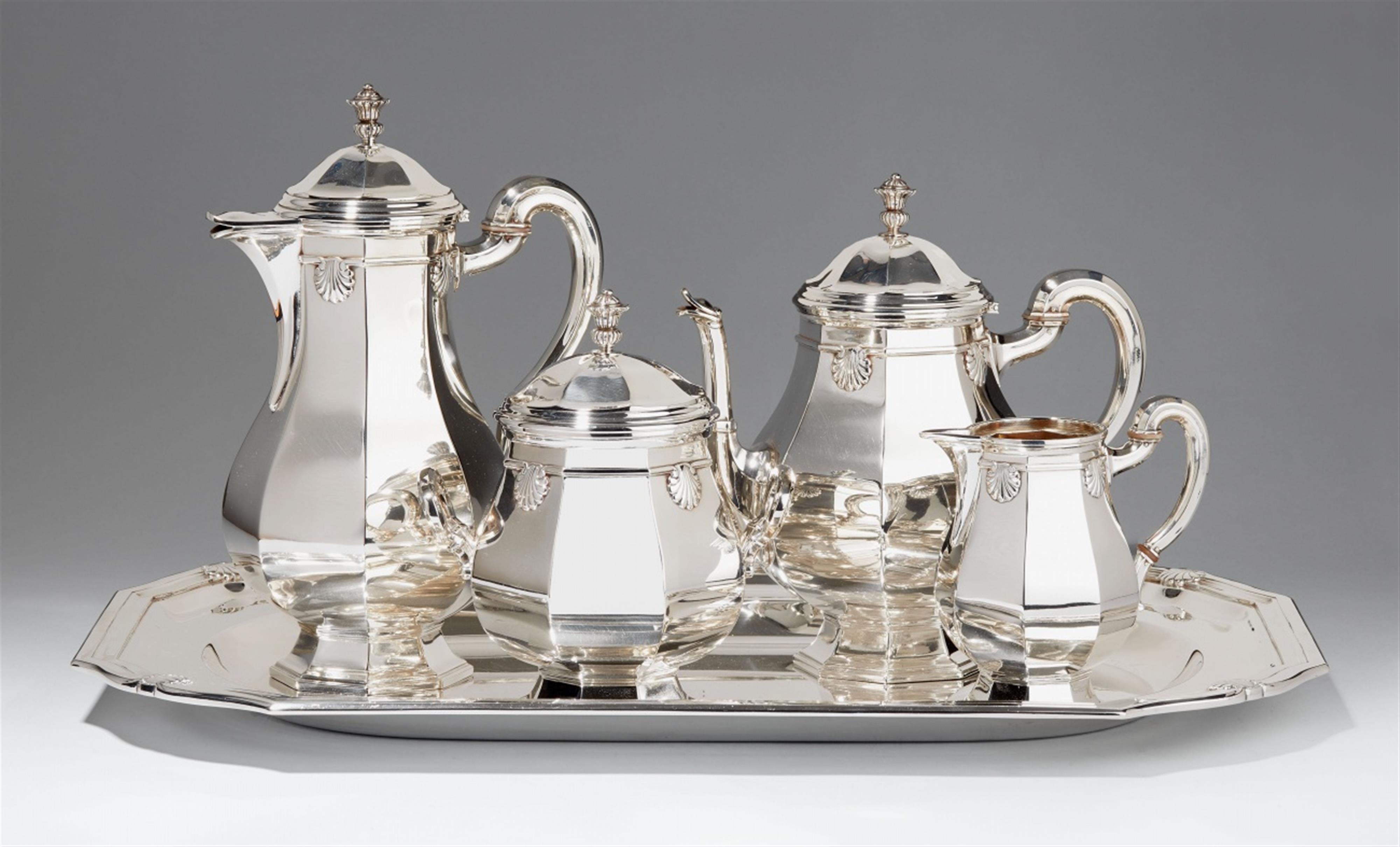 A Brussels partially gilt silver coffee and tea service. Comprising coffee pot, teapot, sugar box, milk jug and a large tray. Marks of Wolfers Frères, ca. 1930/40. - image-1