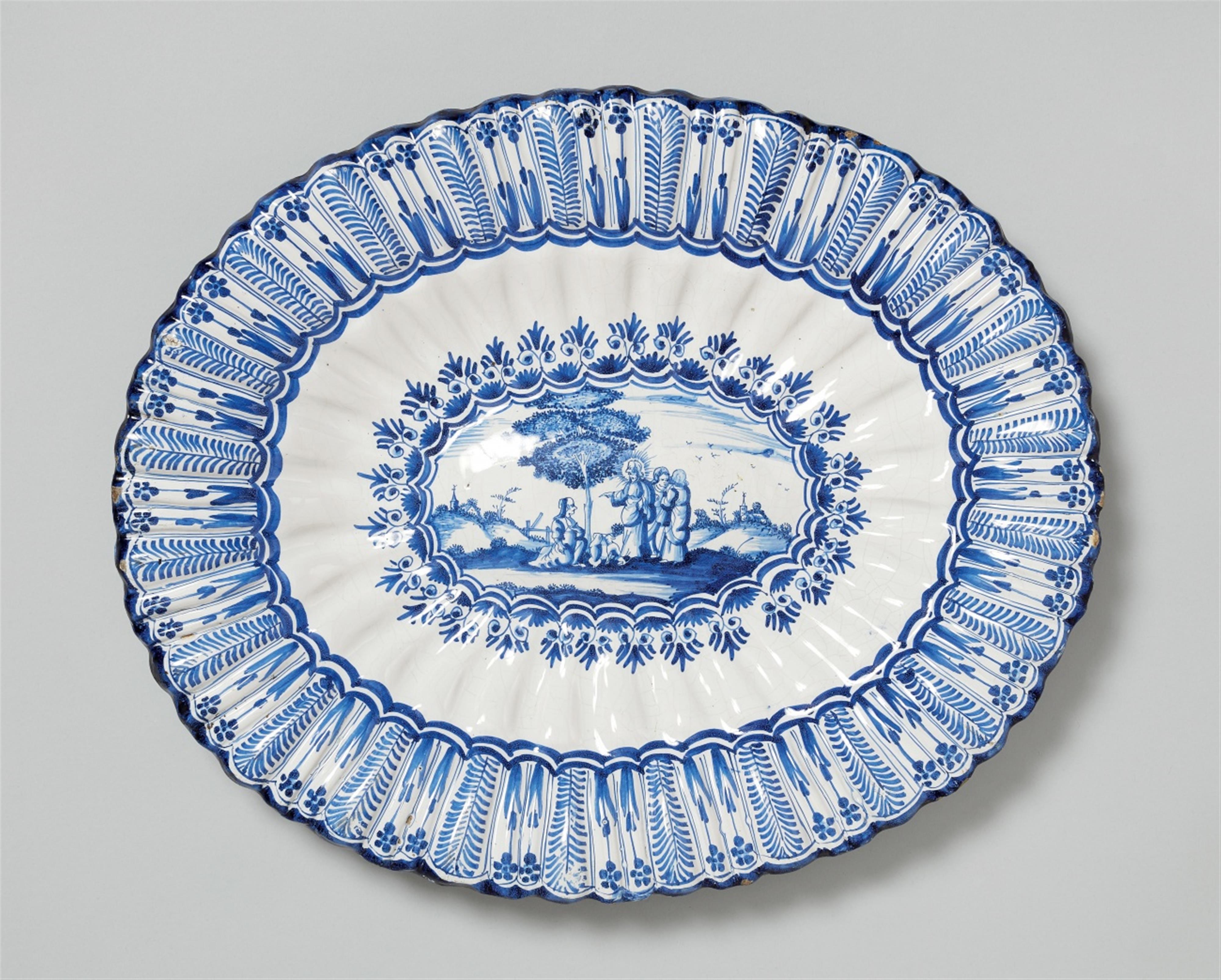 A large Hanau faience platter with blue and white decor - image-1