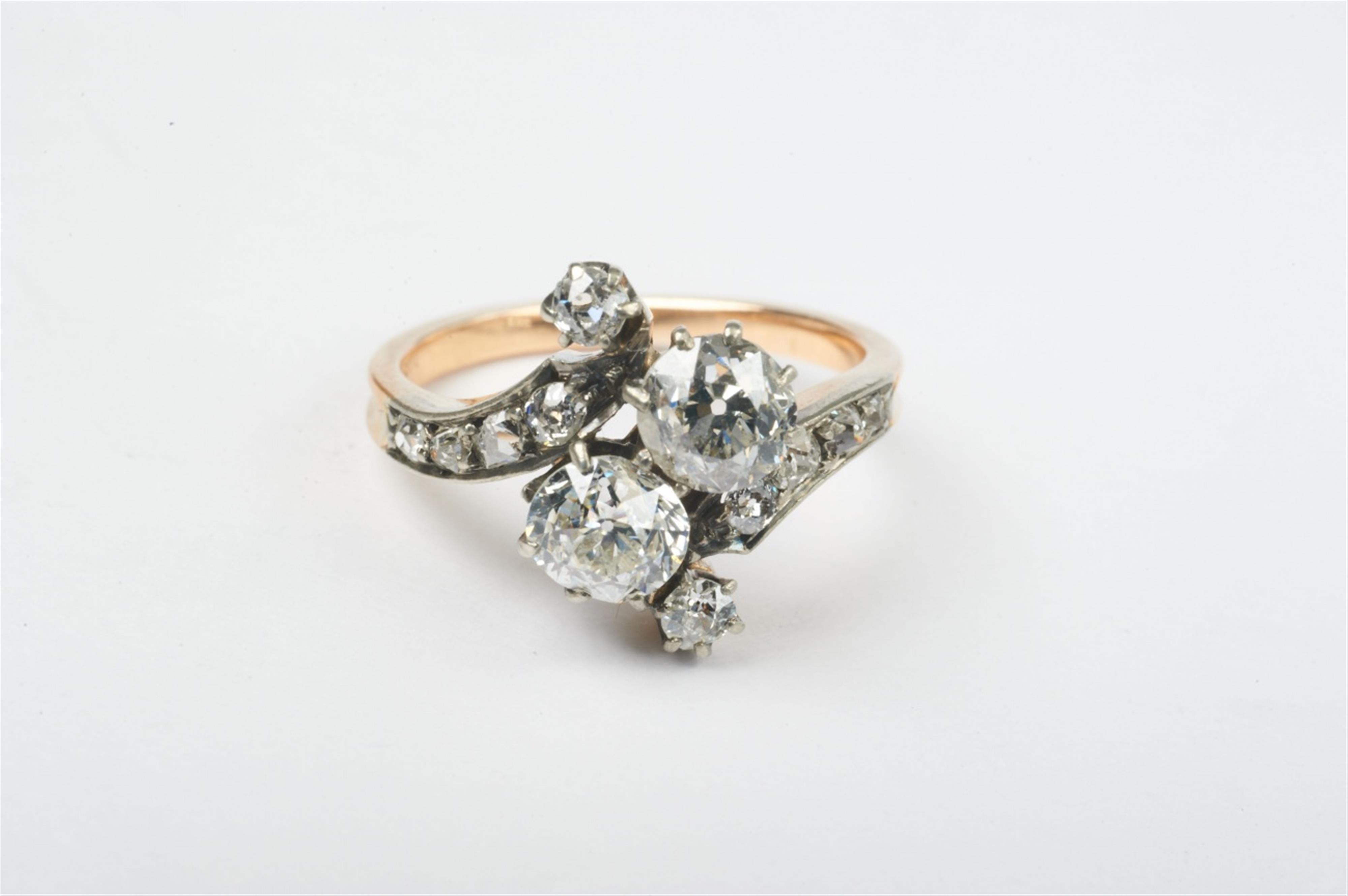 A 14k gold, silver and diamond crossover ring - image-1
