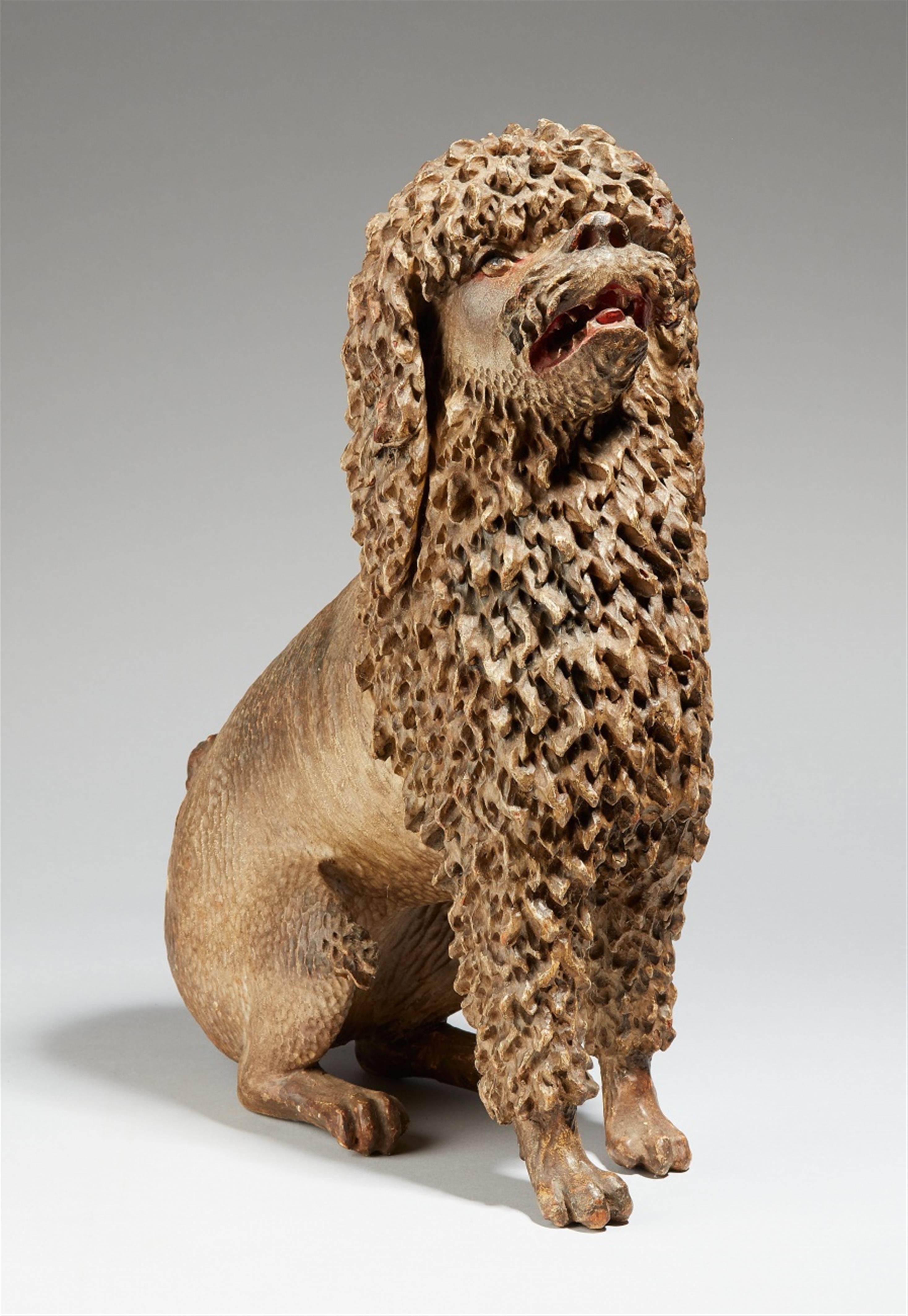 A carved softwood model of a seated poodle - image-1