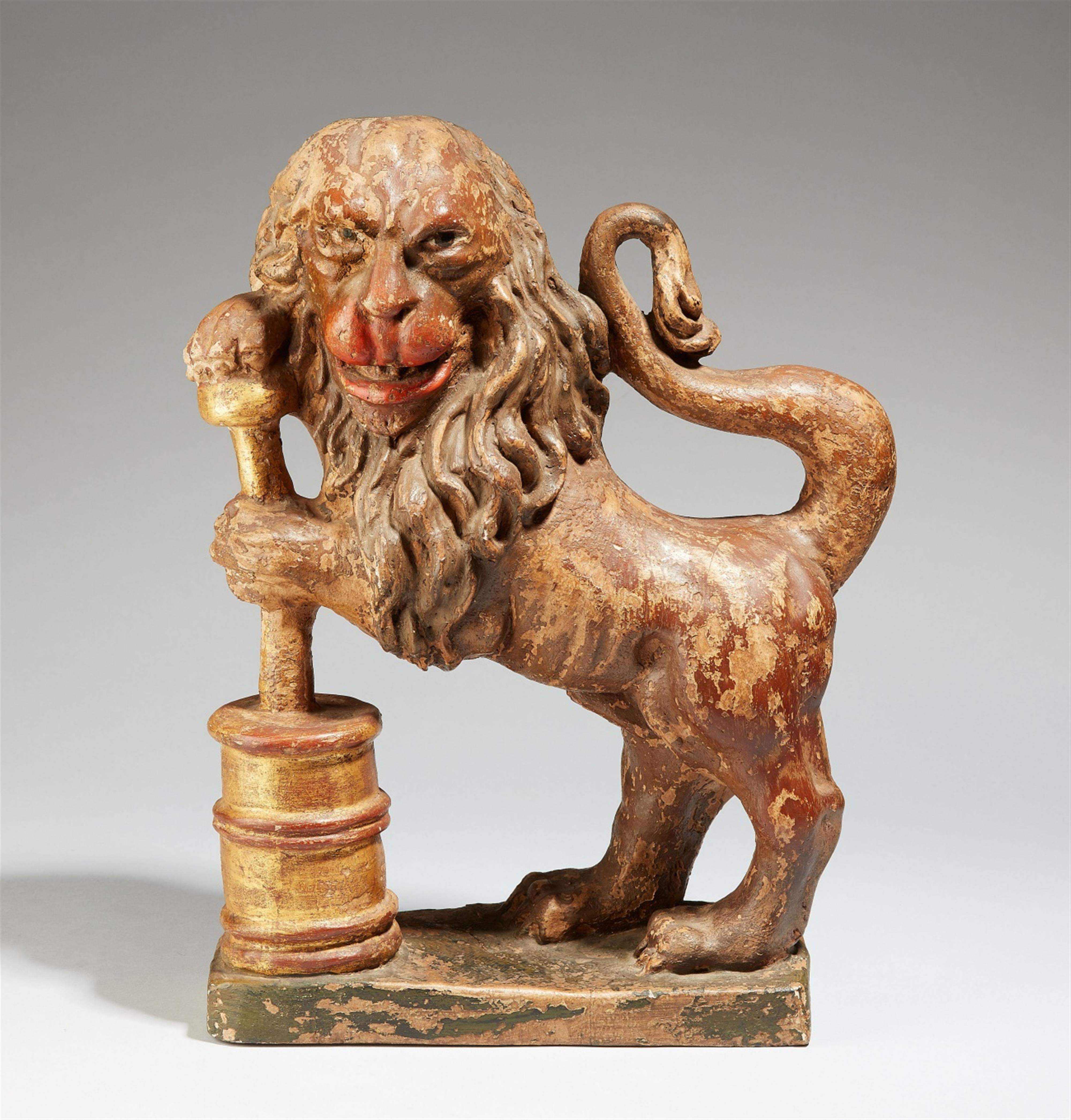 A carved softwood figure of a lion - image-1