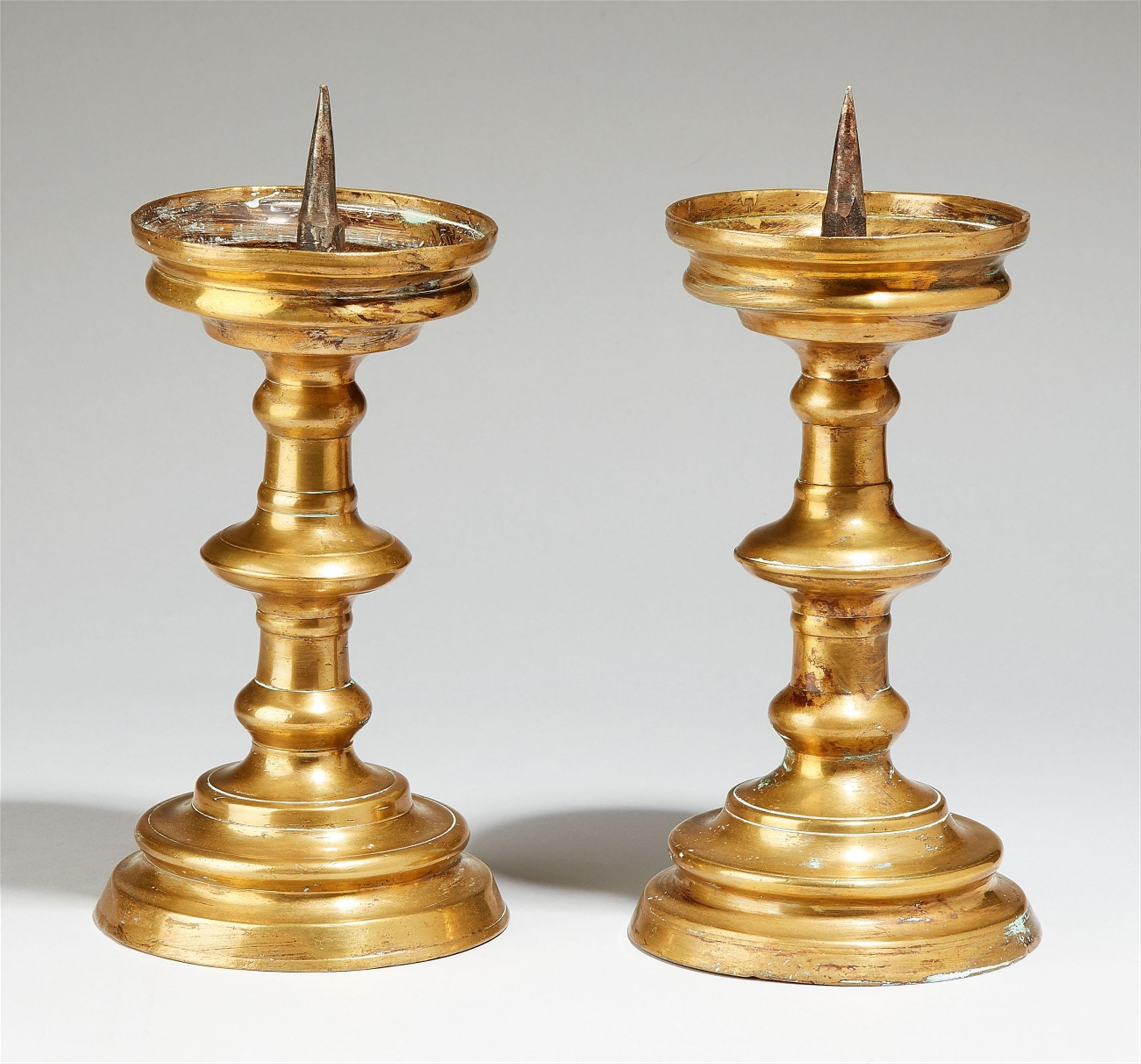A pair of Nuremberg bronze candlesticks - image-1