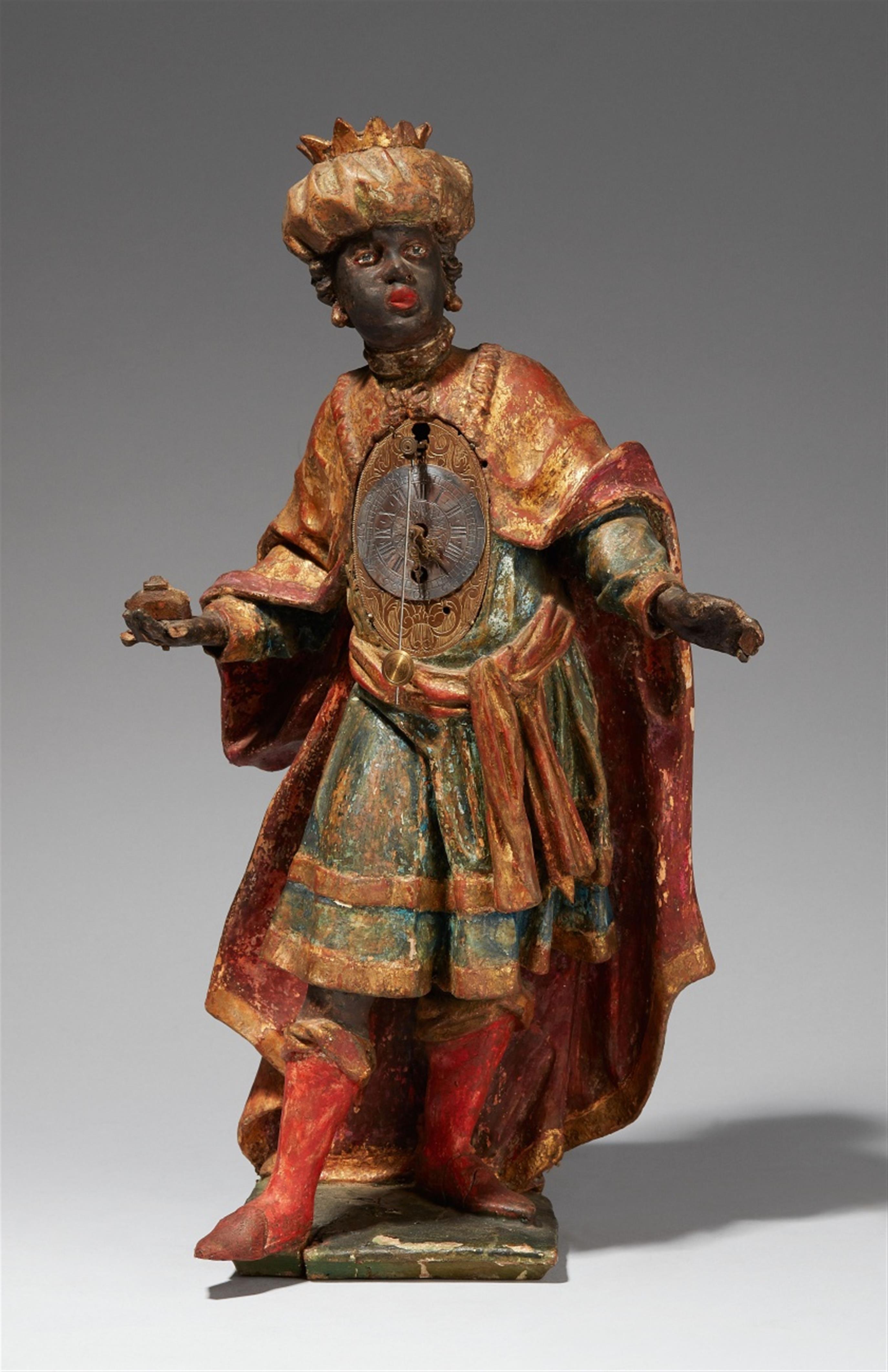 A South German carved wood clock formed as Saint Balthasar - image-1
