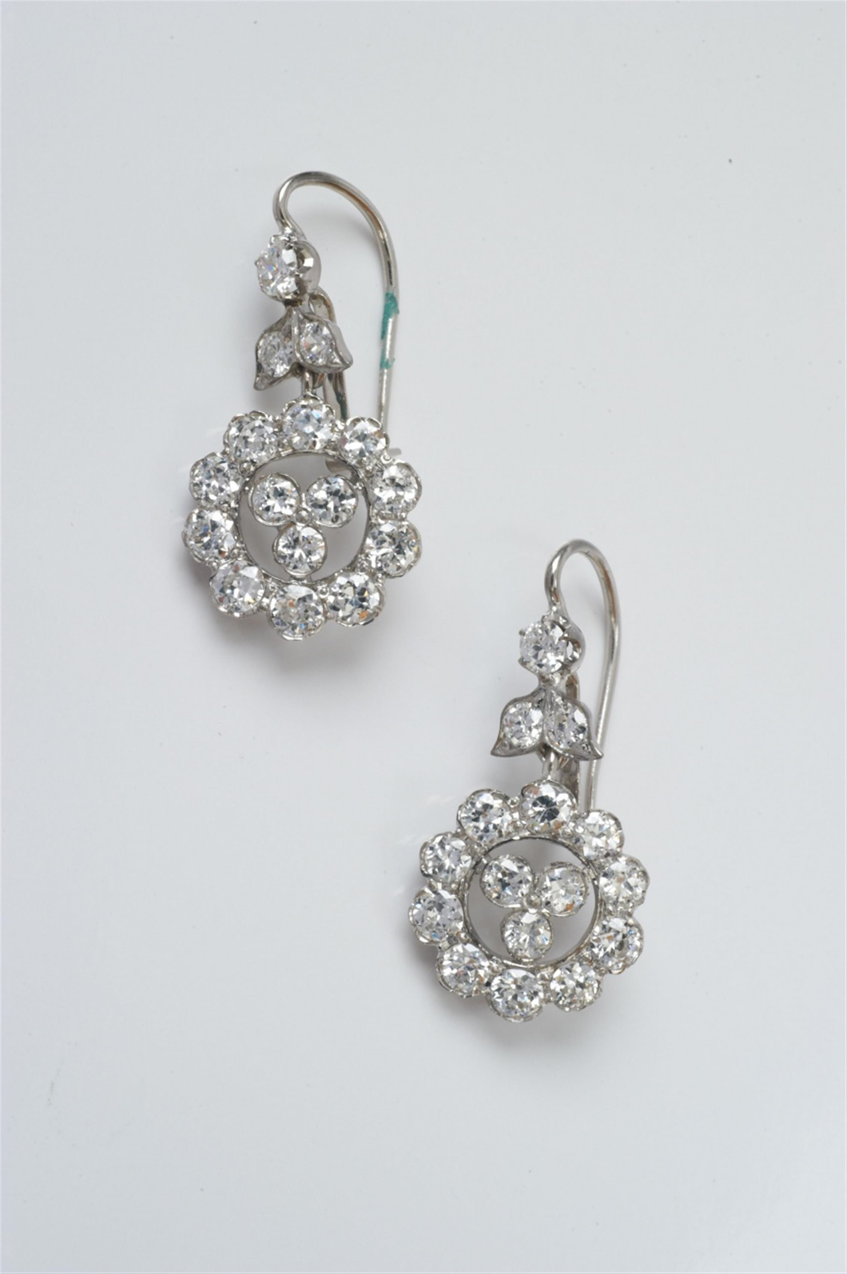 A pair of 14k white gold and diamond Art Deco earrings - image-1