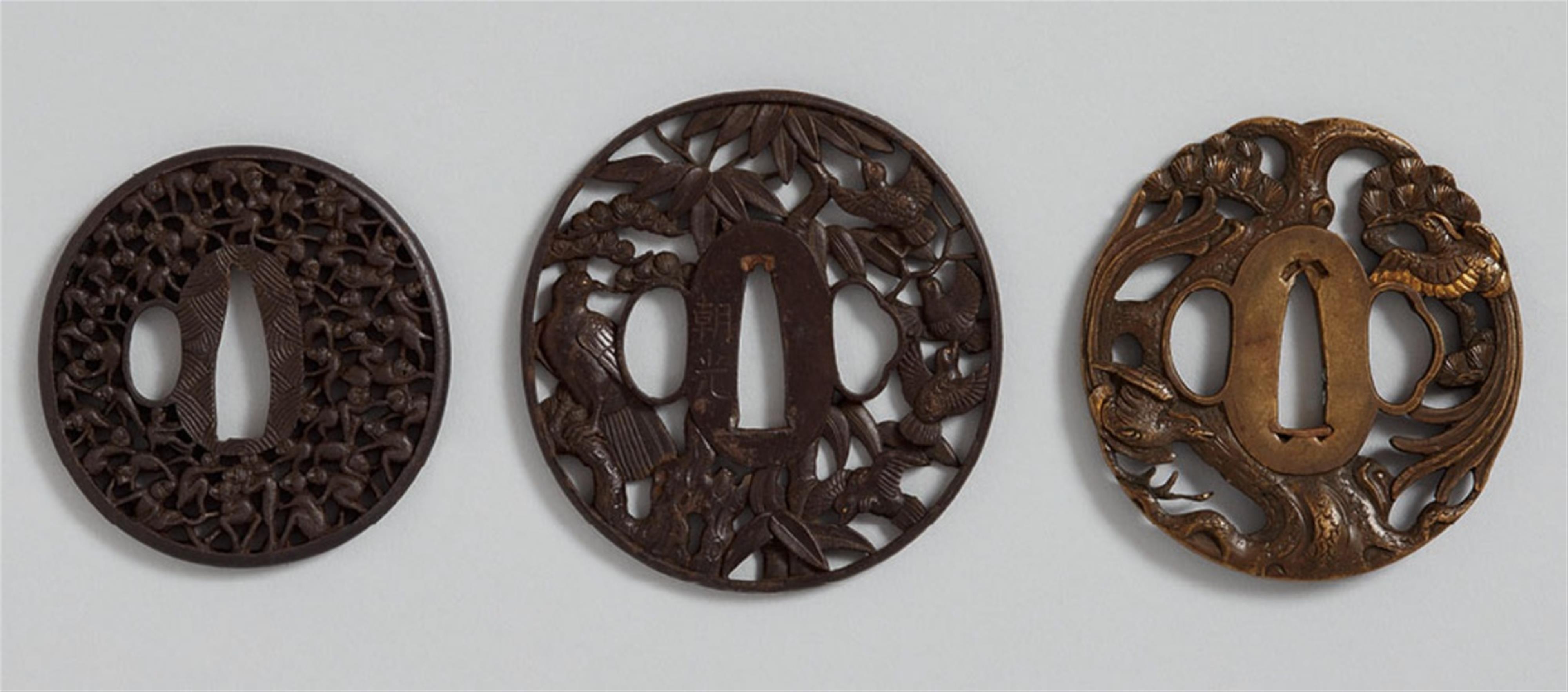 Three oval-shaped tsuba of iron and sentoku. 18th/19th century - image-1