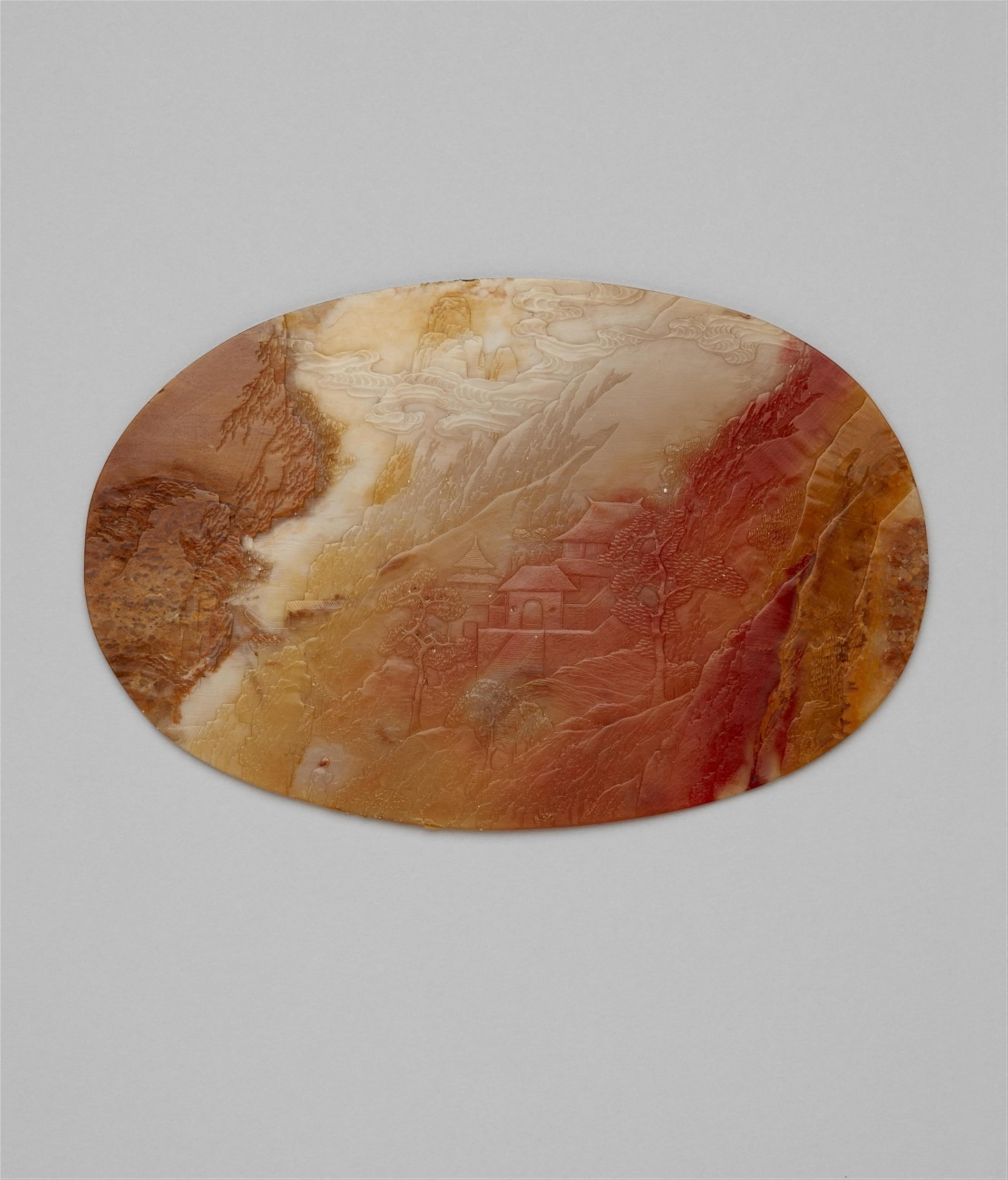 A thin, oval soapstone plaque - image-1