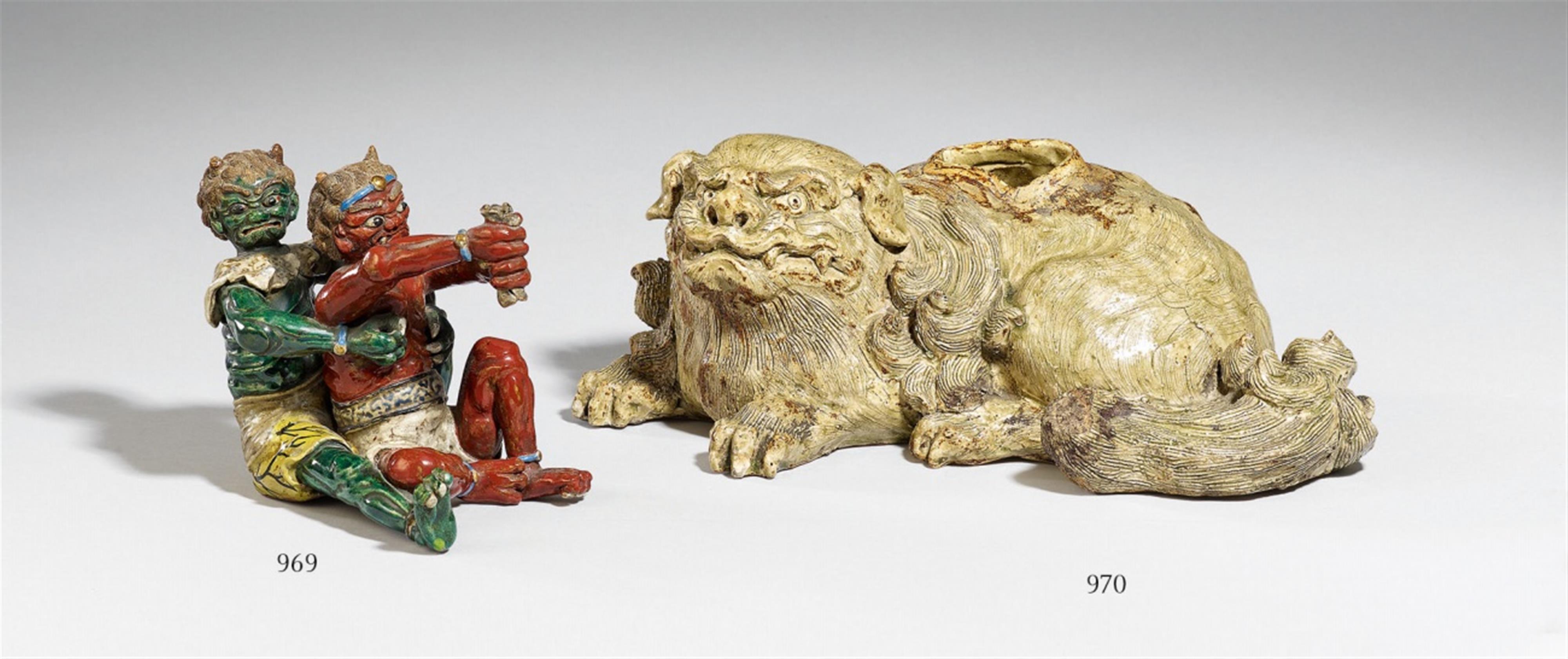 A possibly Kutani figure group of two oni. Late 19th century - image-1