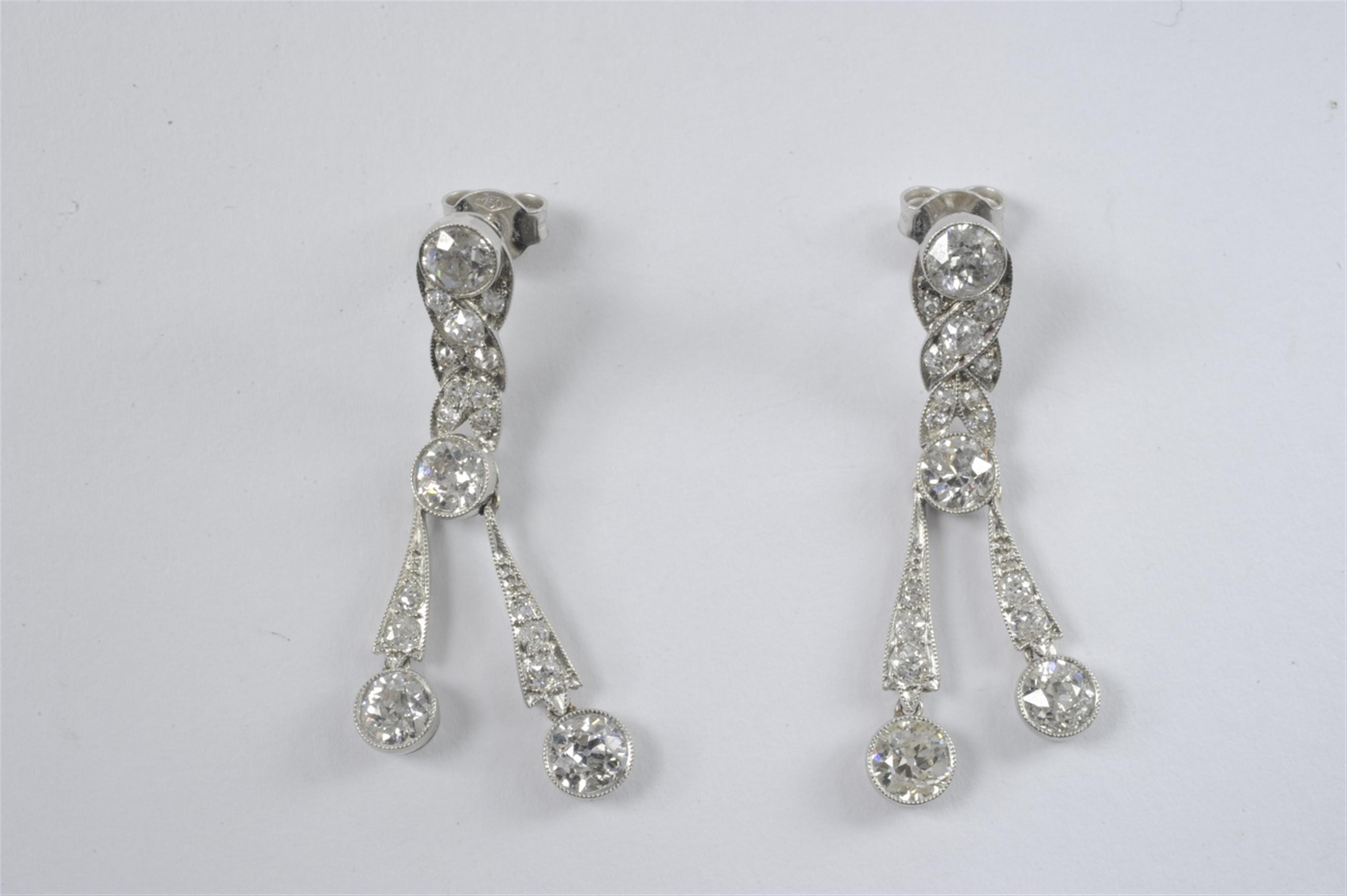 A pair of Art Deco platinum and diamond pendant earrings - image-1
