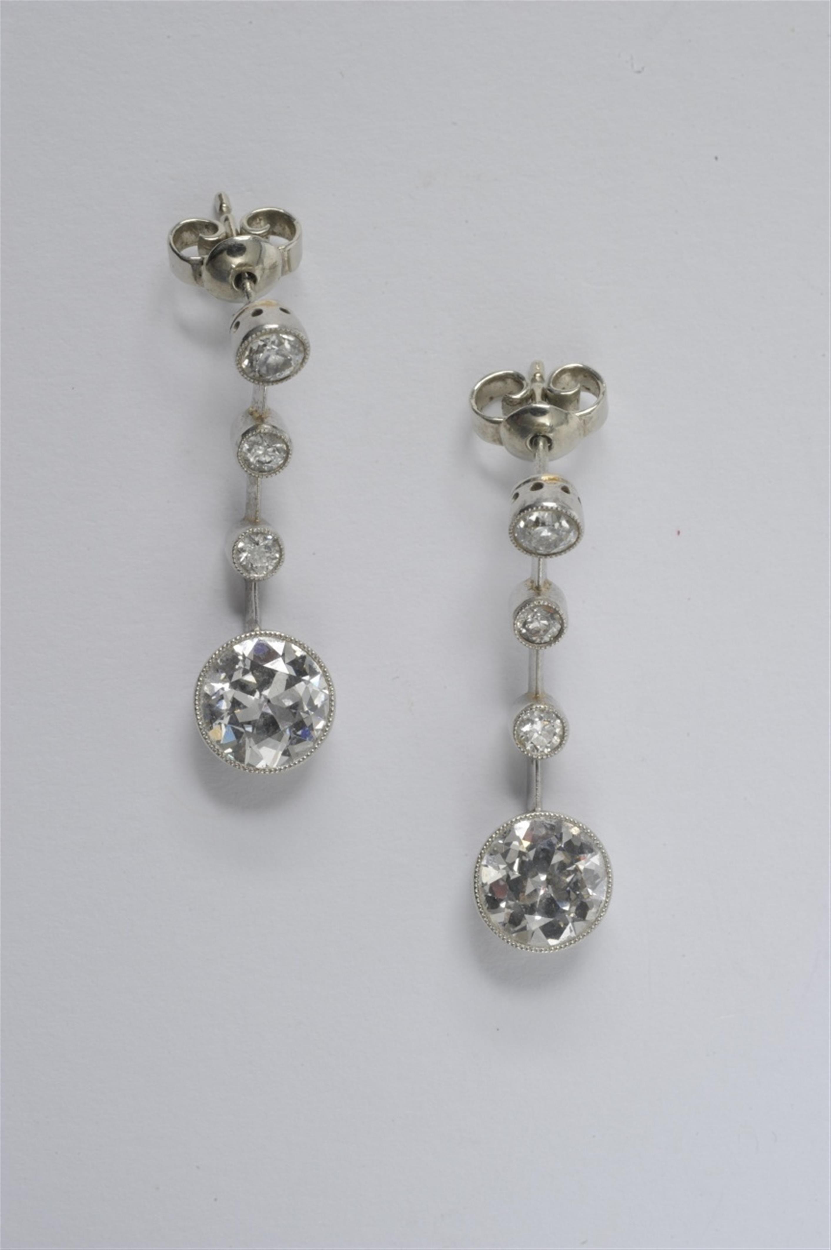 A pair of platinum Art Deco pendant earrings - image-1