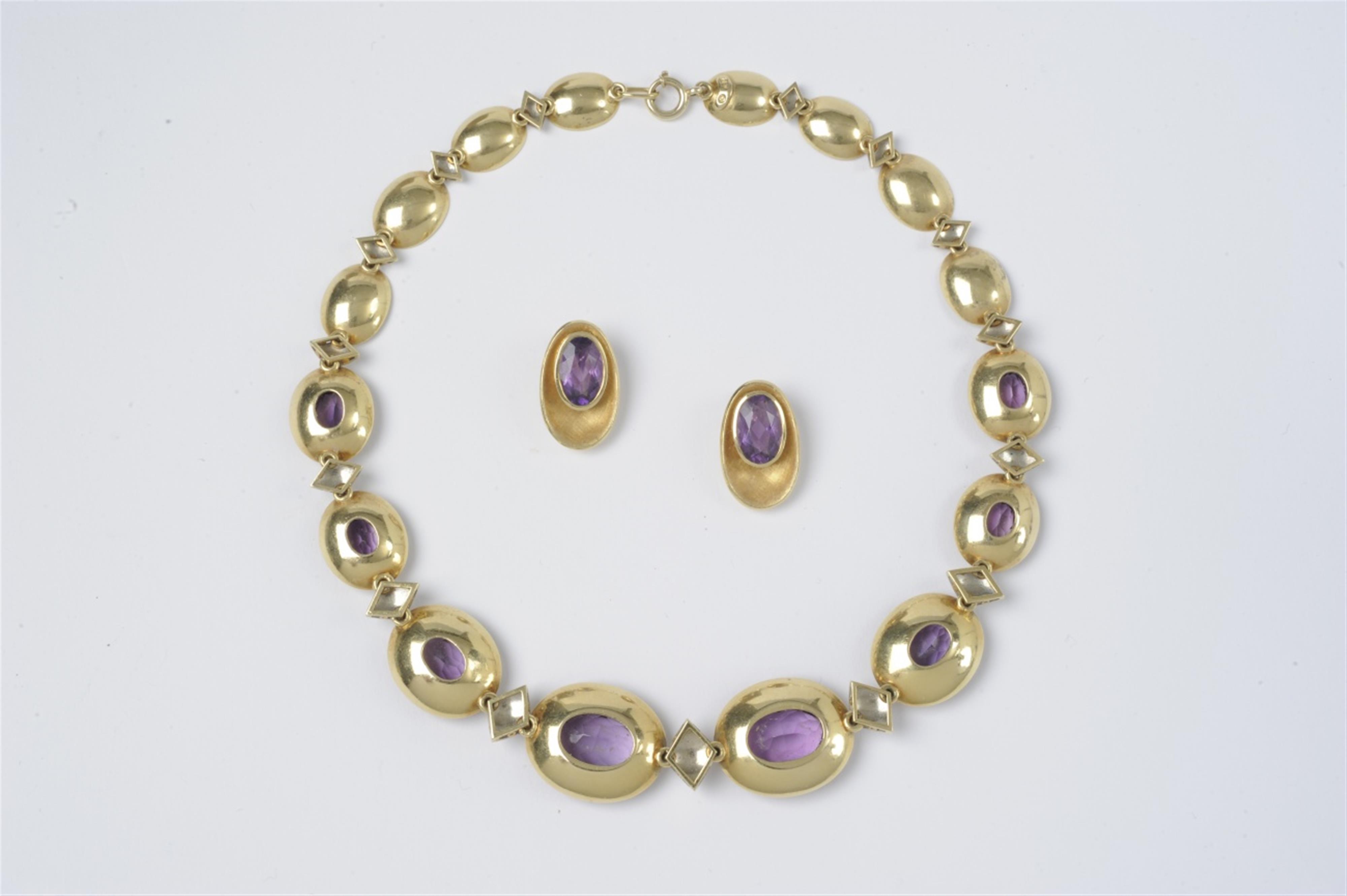 An 18k gold and amethyst demi parure - image-1