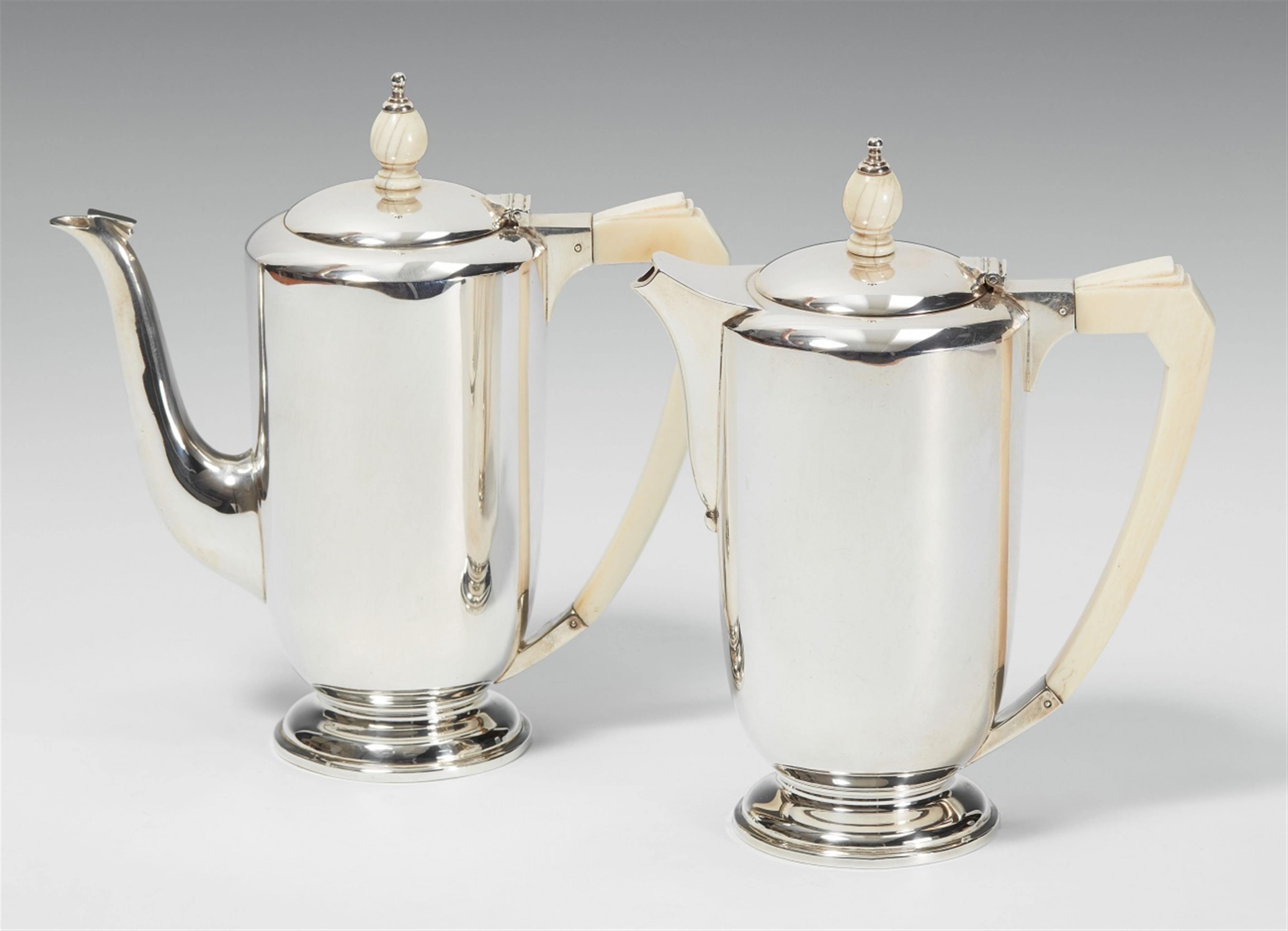 An Art Déco London silver mocca jug and a hot chocolate jug. Marks of Asprey & Co, 1937. - image-1