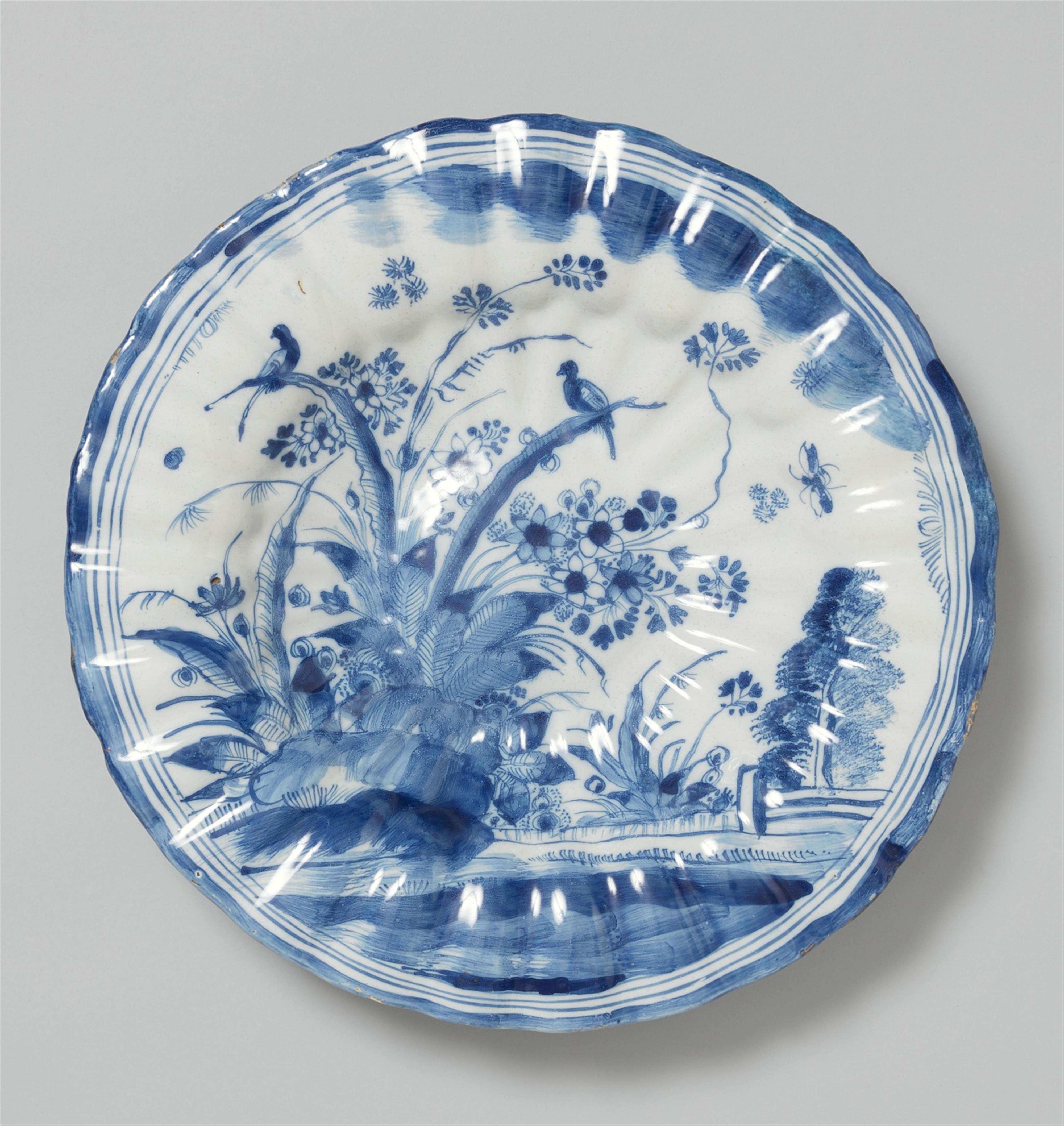 An early Hanau faience platter with blue and white garden decor - image-1