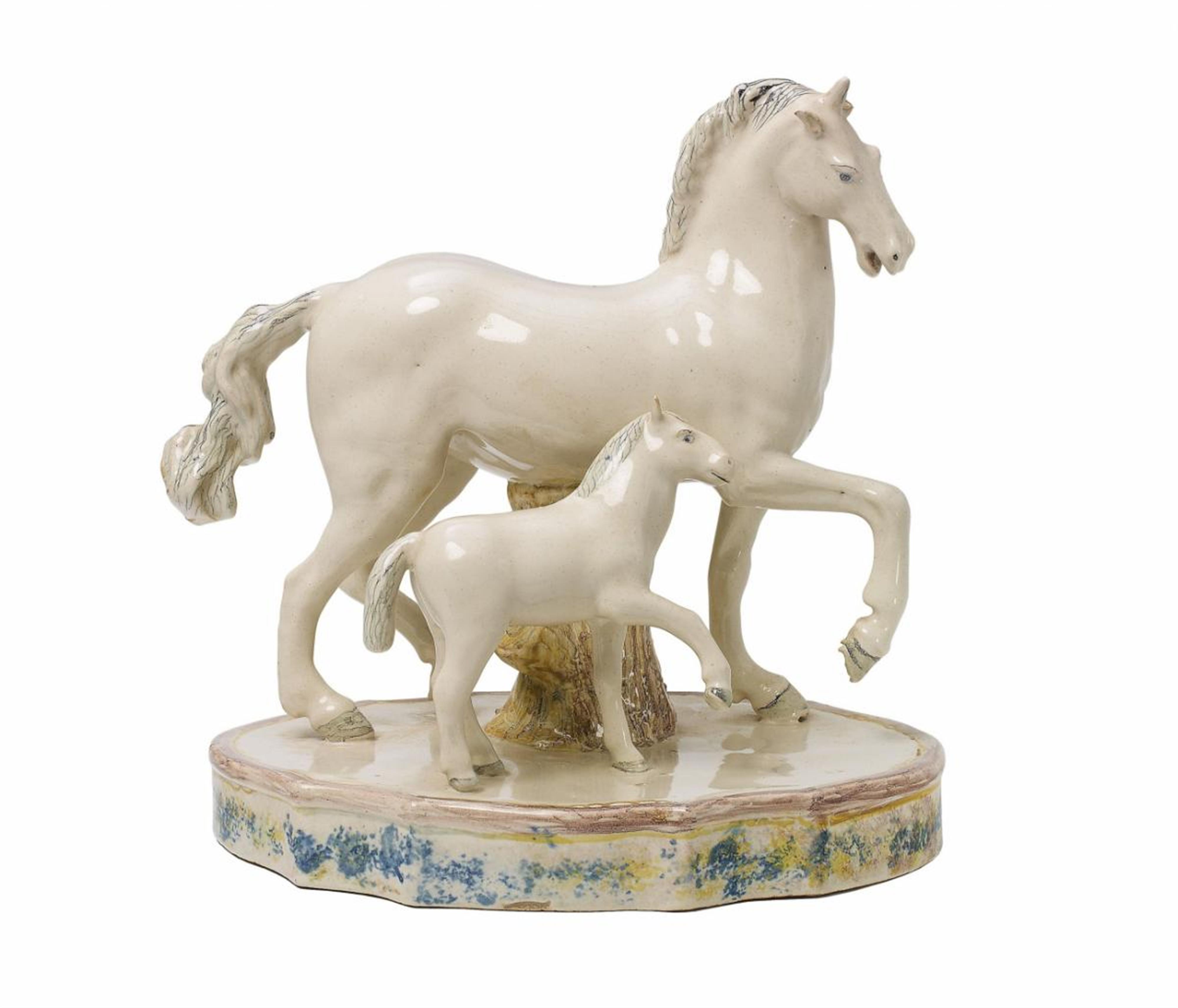 A Continental white-glazed faience model of a unicorn and foal - image-1