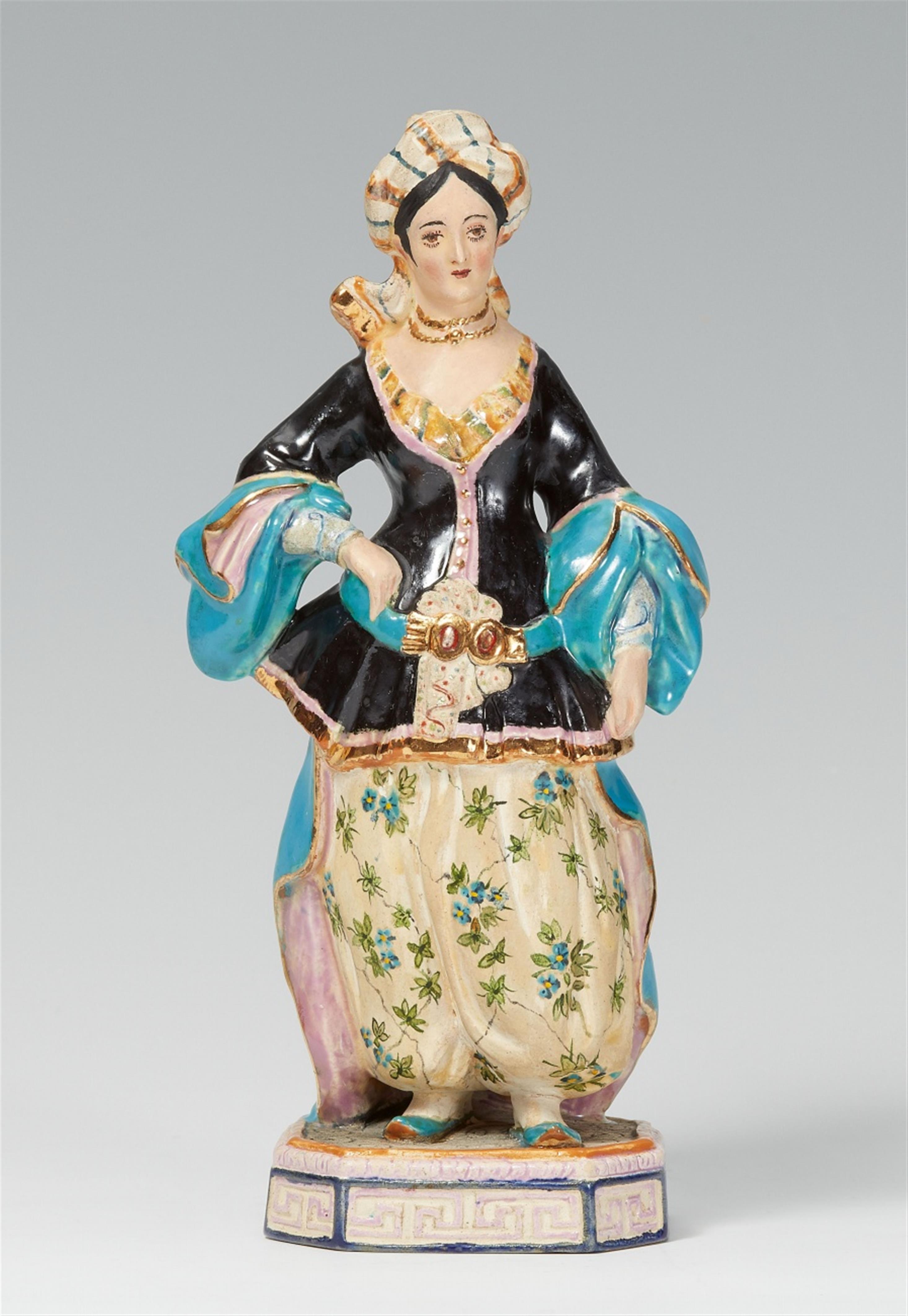 A Moscow Popov Manufactory porcelain figure of an Oriental lady - image-1