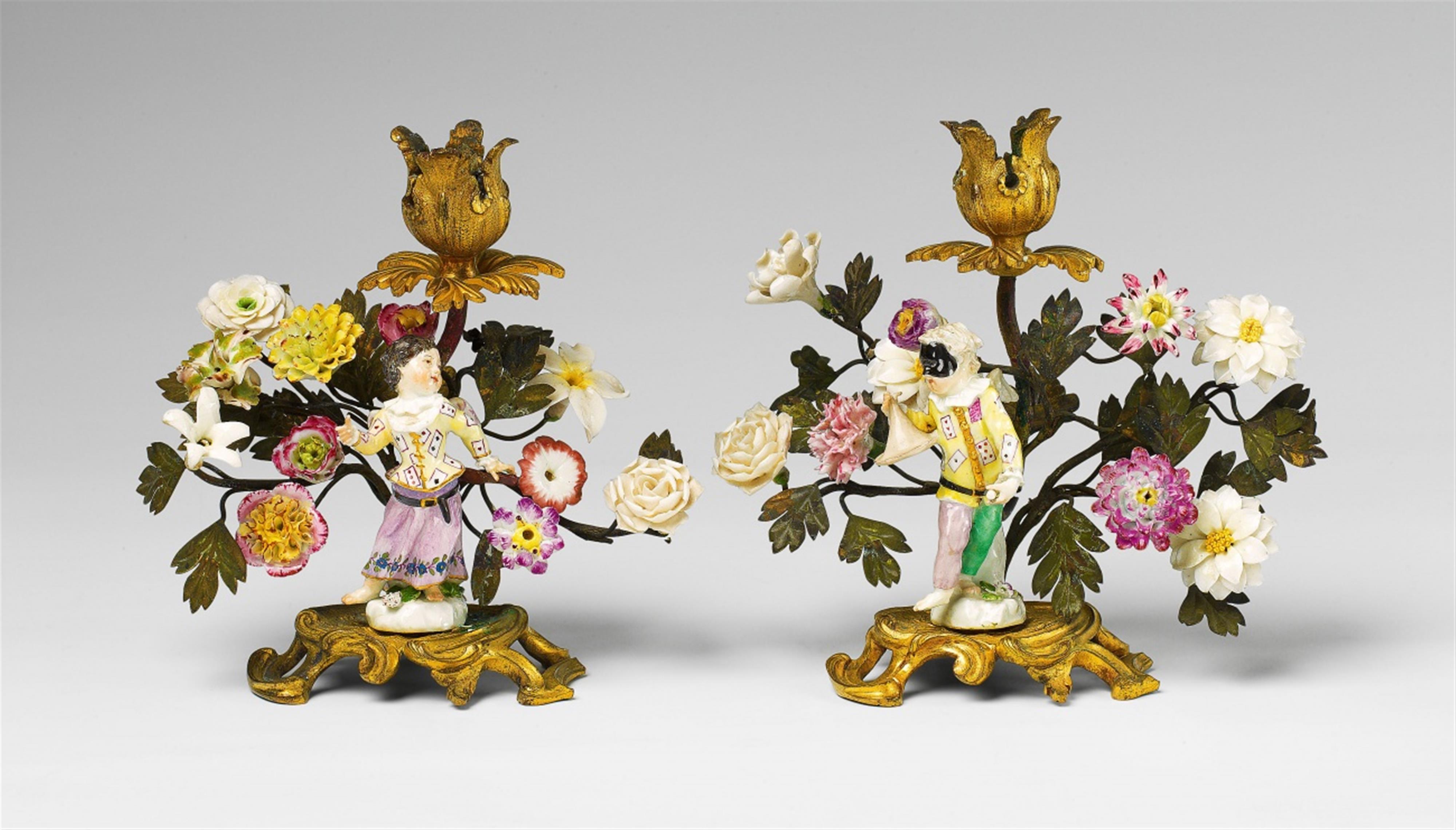 A pair of Parisian ormolu candlesticks with porcelain figures - image-1