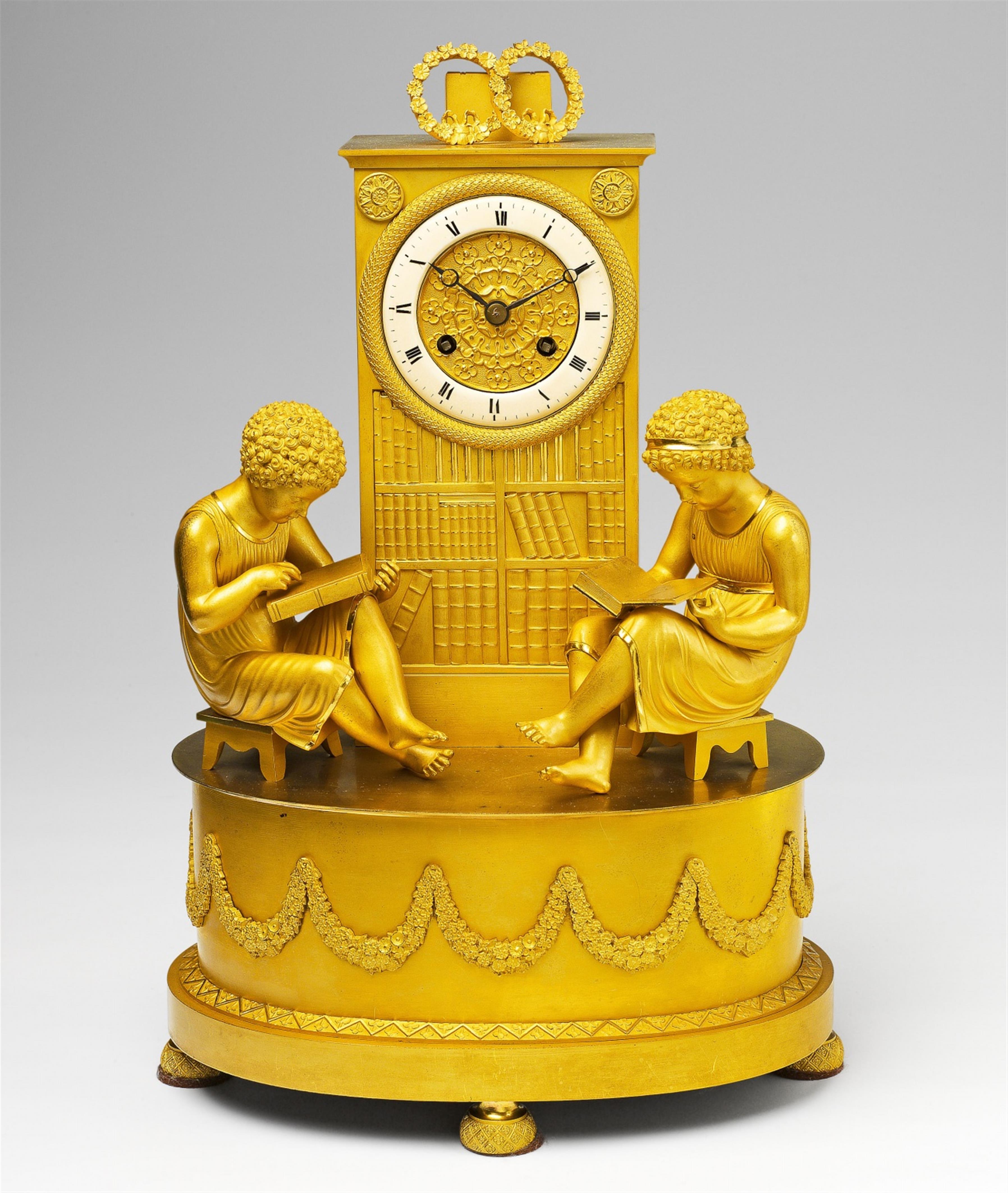 A Parisian Empire pendulum clock with youths reading - image-1