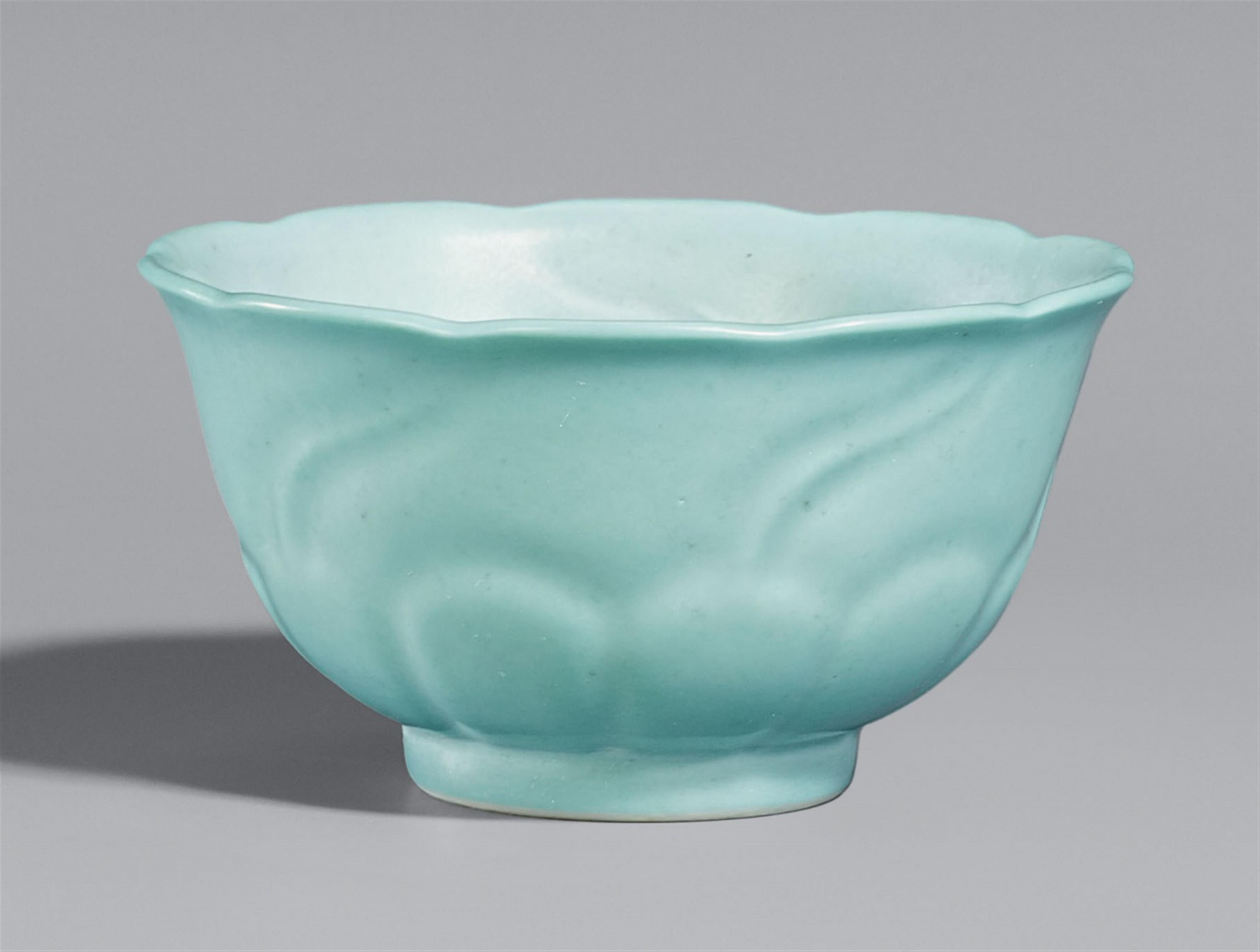 A turquoise-glazed blossom-shaped cup - image-1