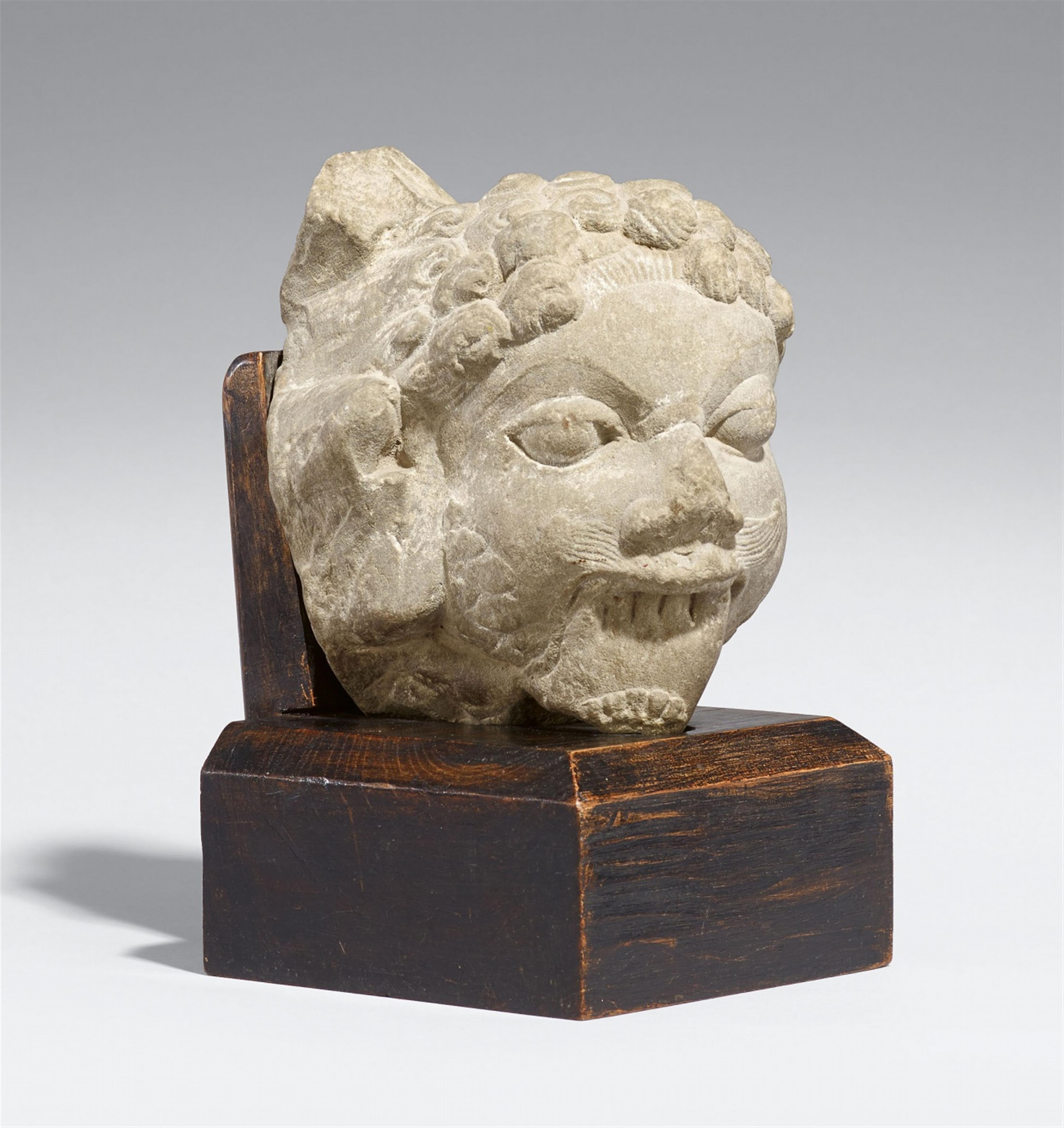 An Indian sandstone head of a demon. 10th/13th century - image-1