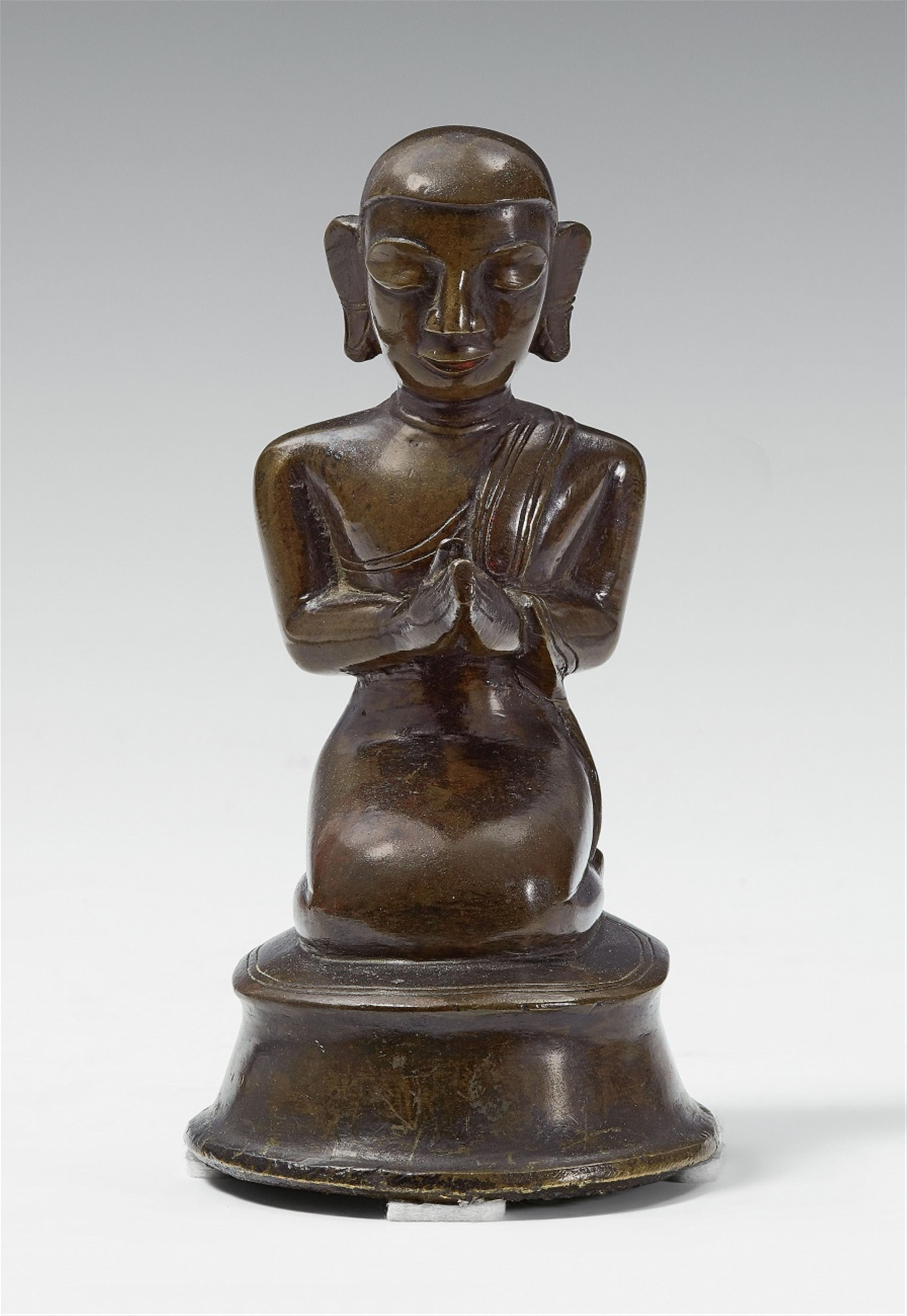 A Thai or Burmese bronze figure of a monk. 18th/19th century - image-1