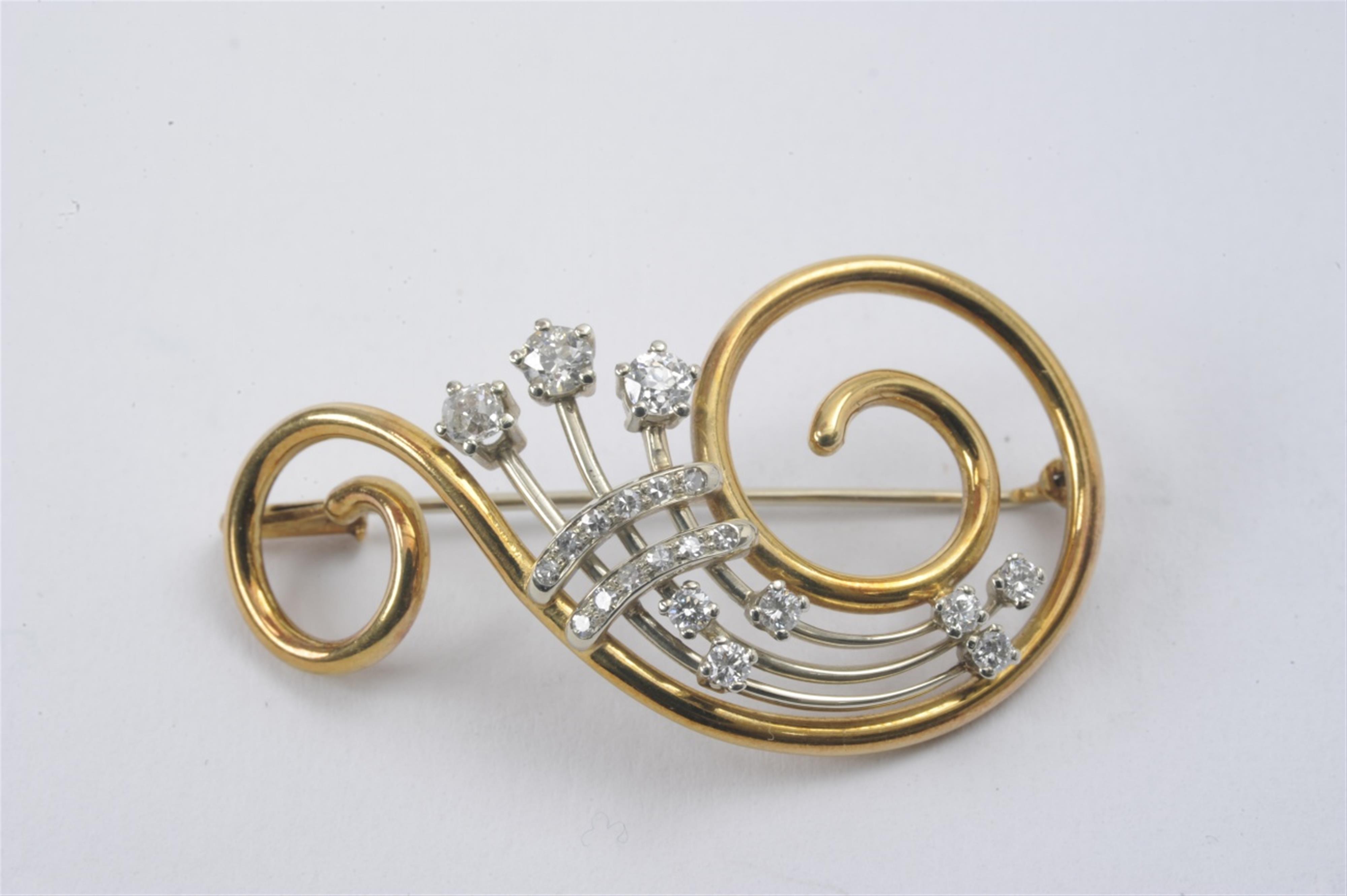 An 18k gold and diamond brooch - image-1