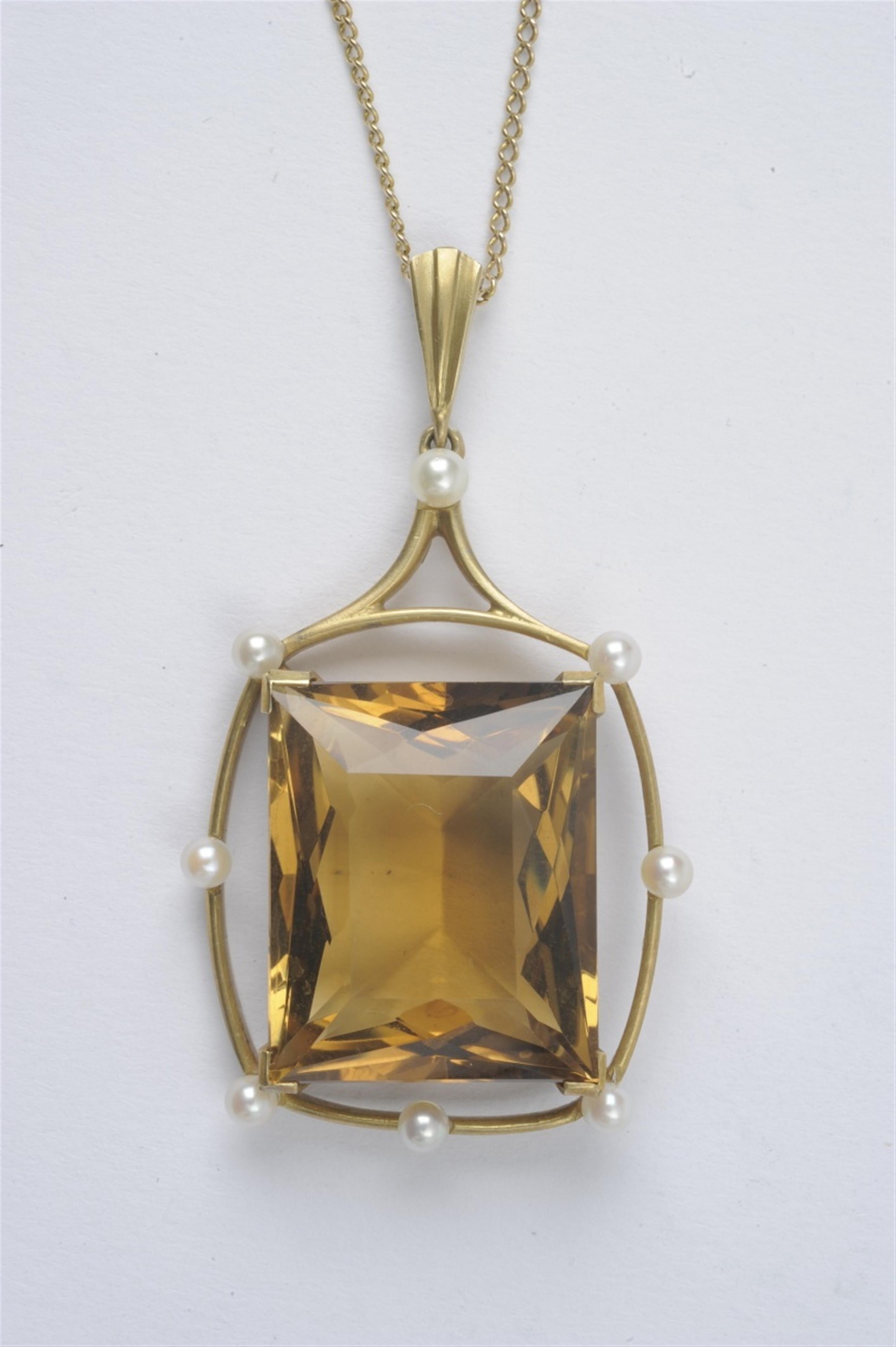 A large silver gilt pendant with a citrine - image-1