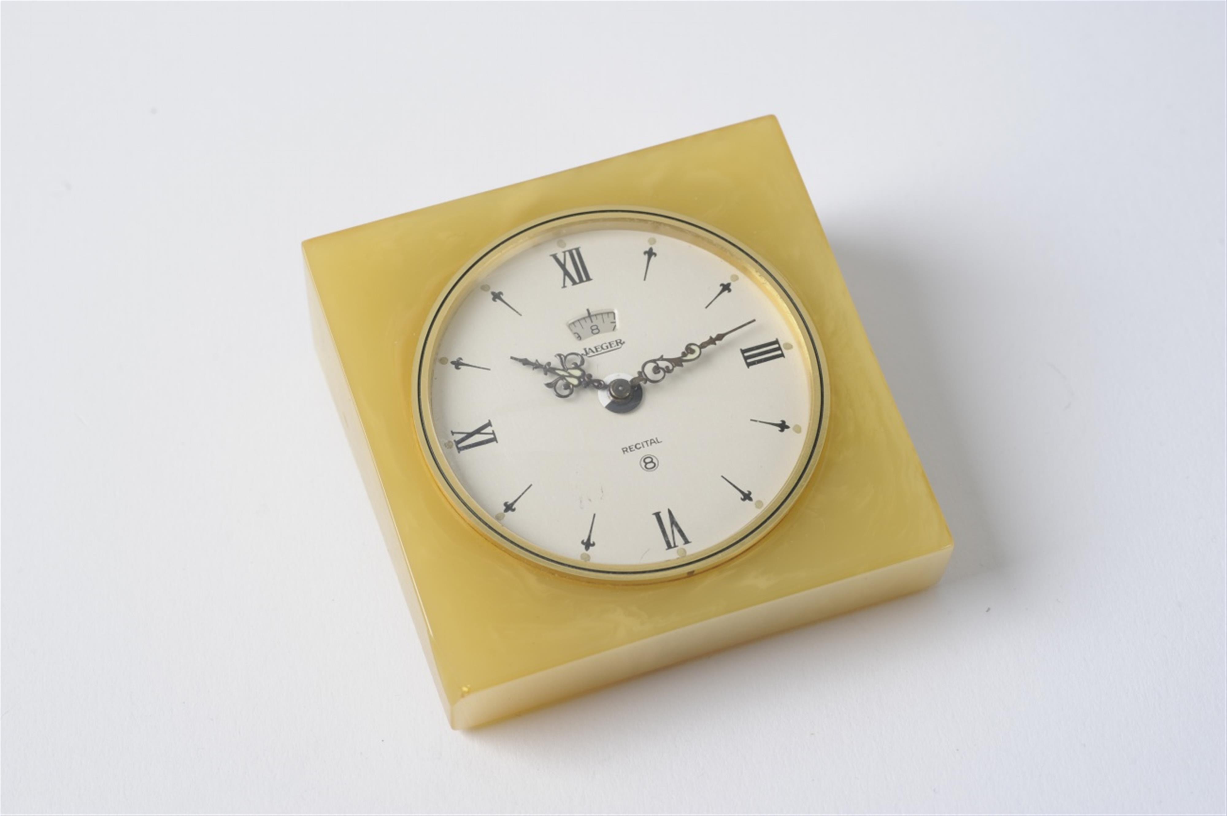 A Jaeger Le Coultre gilt metal and marble-effect bakelite table alarm clock - image-4