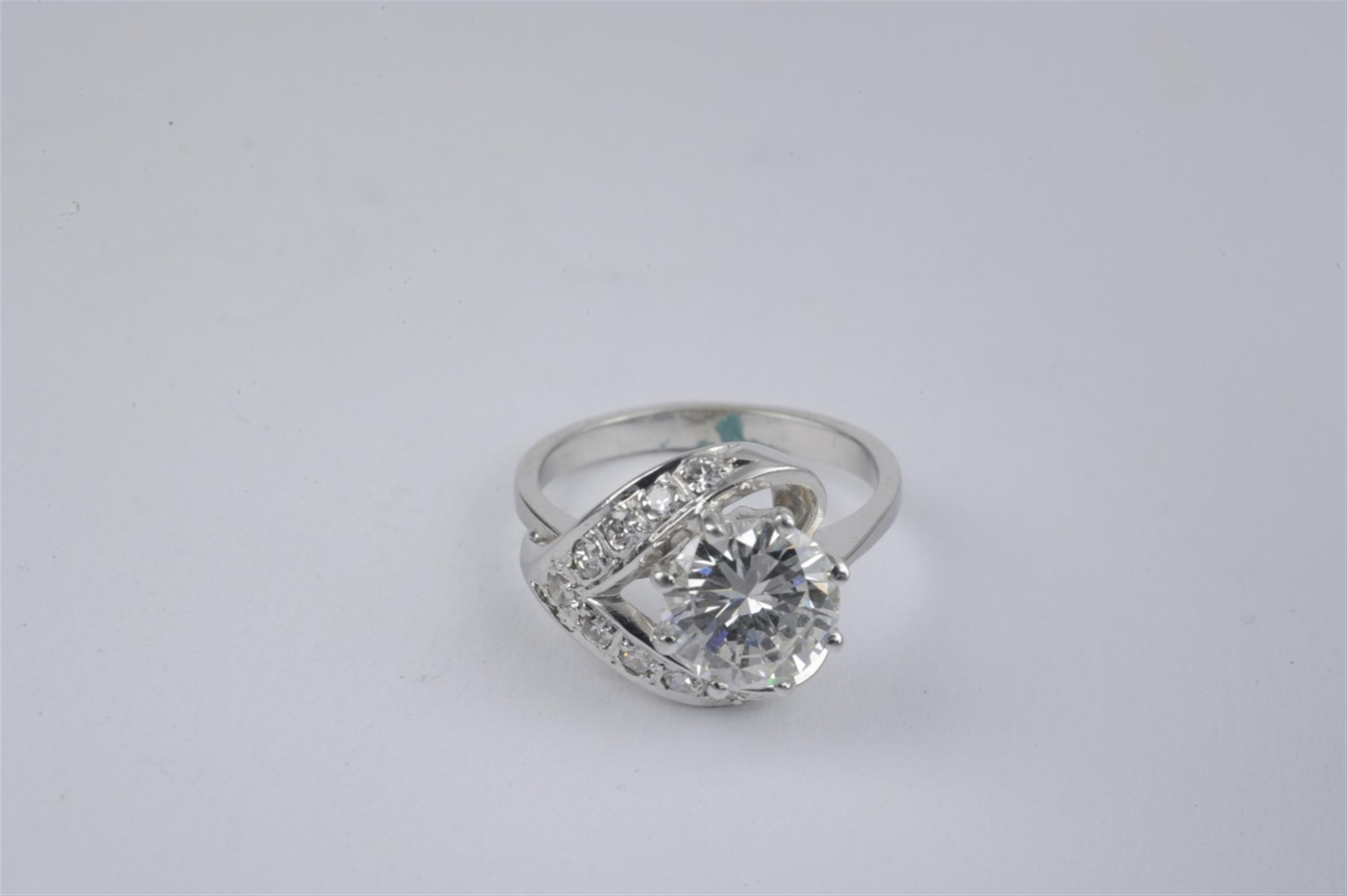 A platinum and diamond solitaire ring - image-1