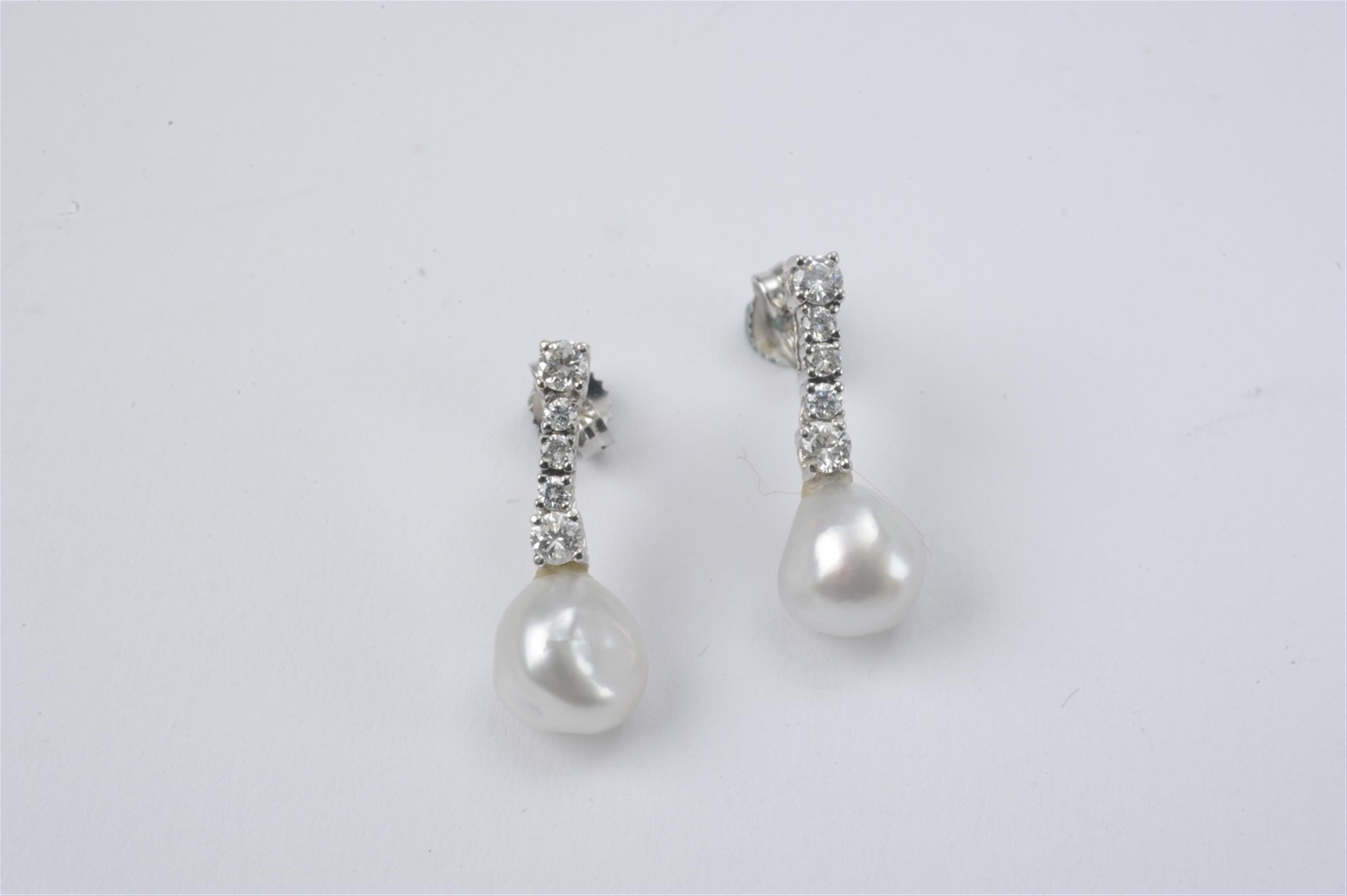 A pair of 14k white gold and pearl pendant earrings - image-1