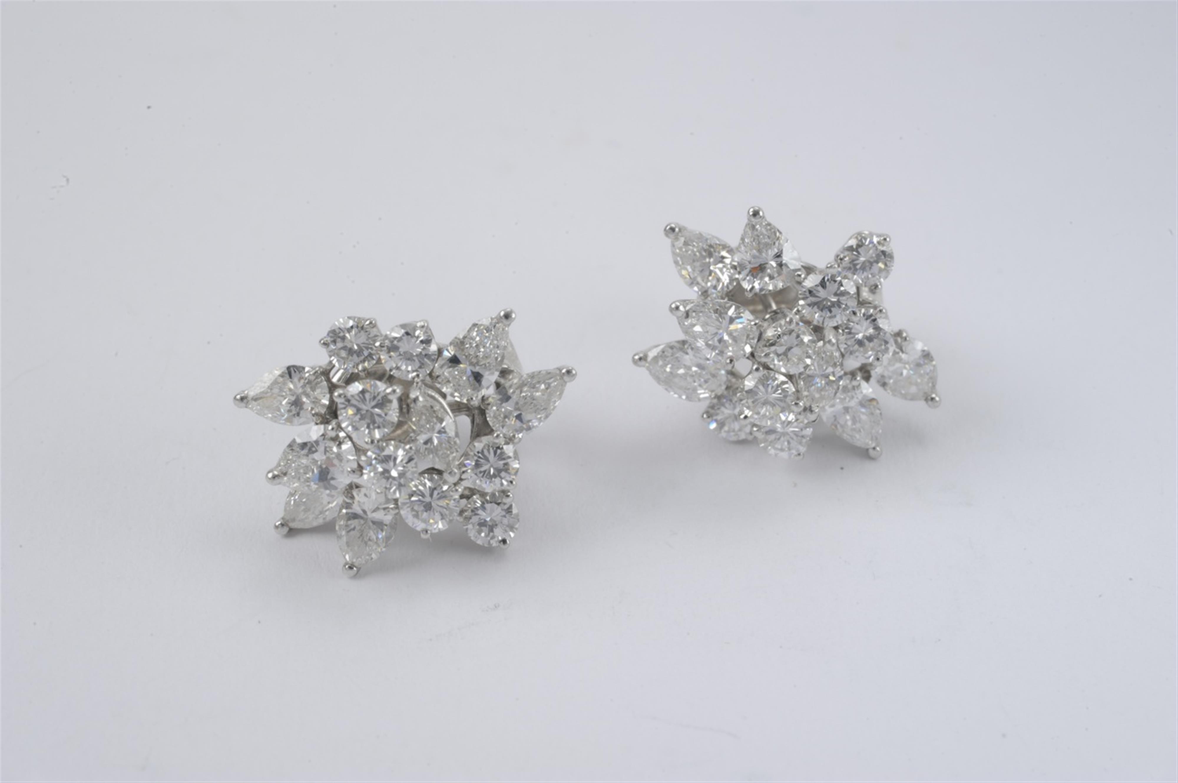 A pair of 18k white gold and diamond clip earrings - image-1
