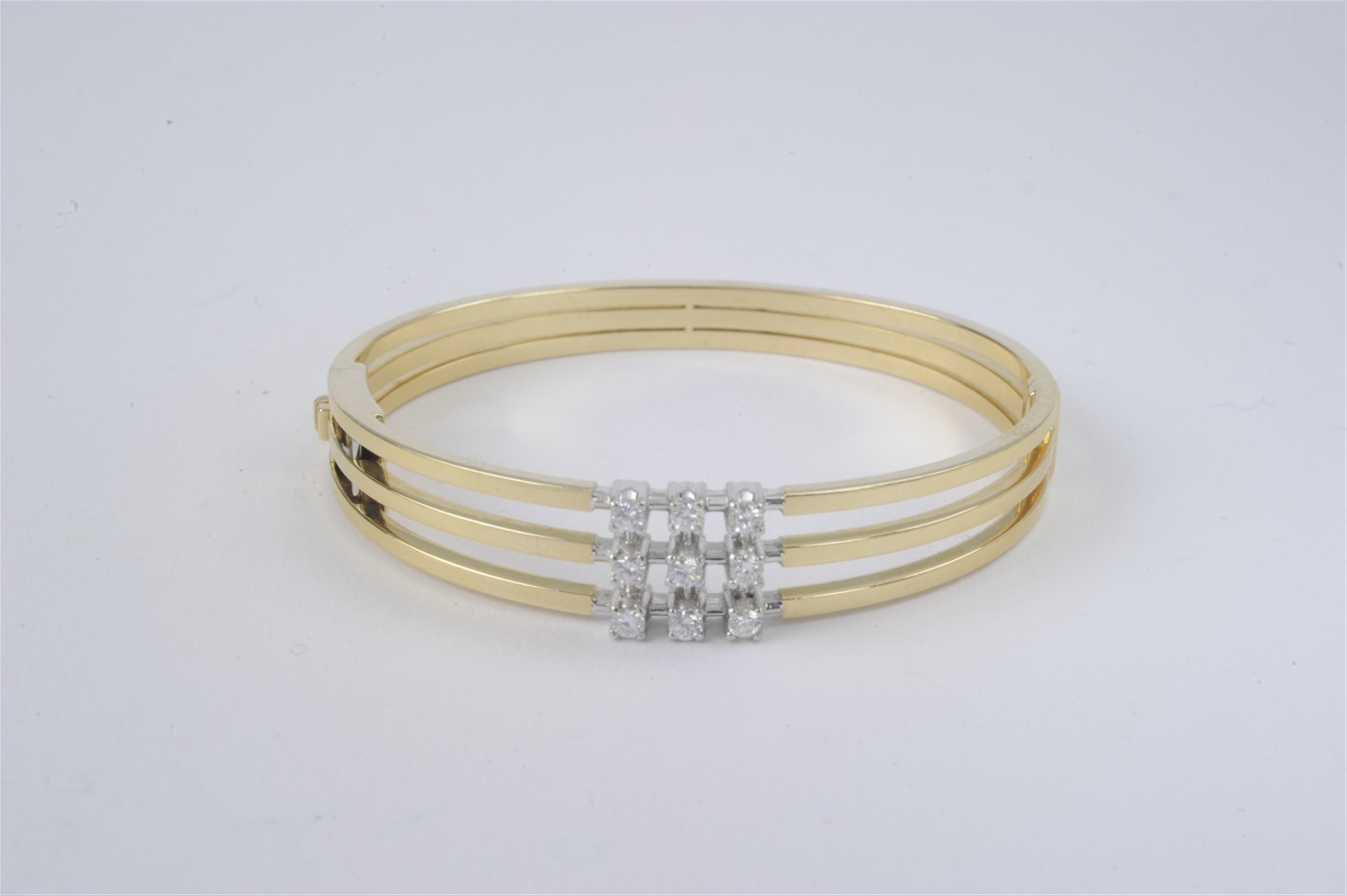 An 18k gold and diamond bangle - image-1