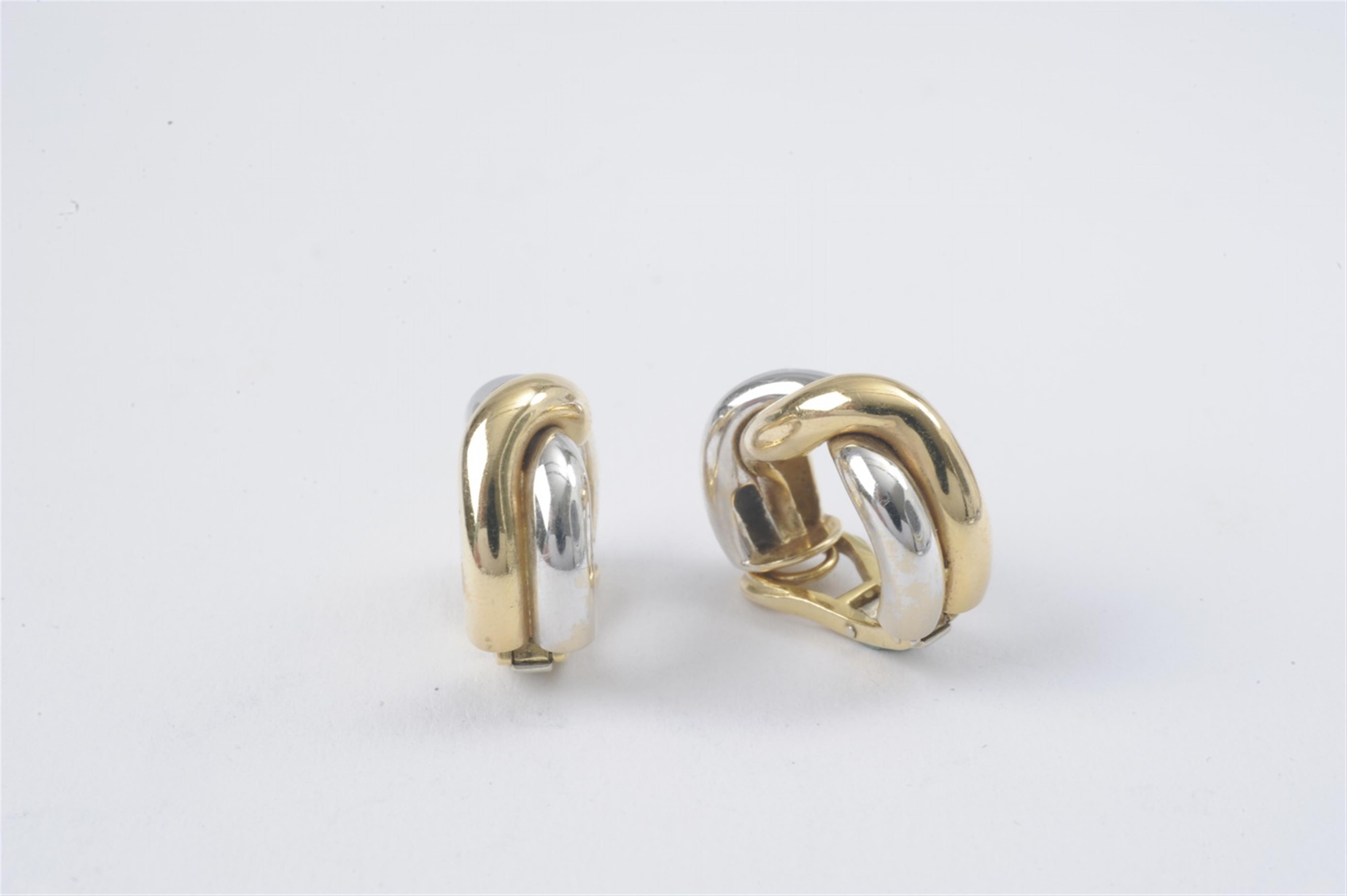 A pair of 18k white and yellow gold clip earrings - image-1