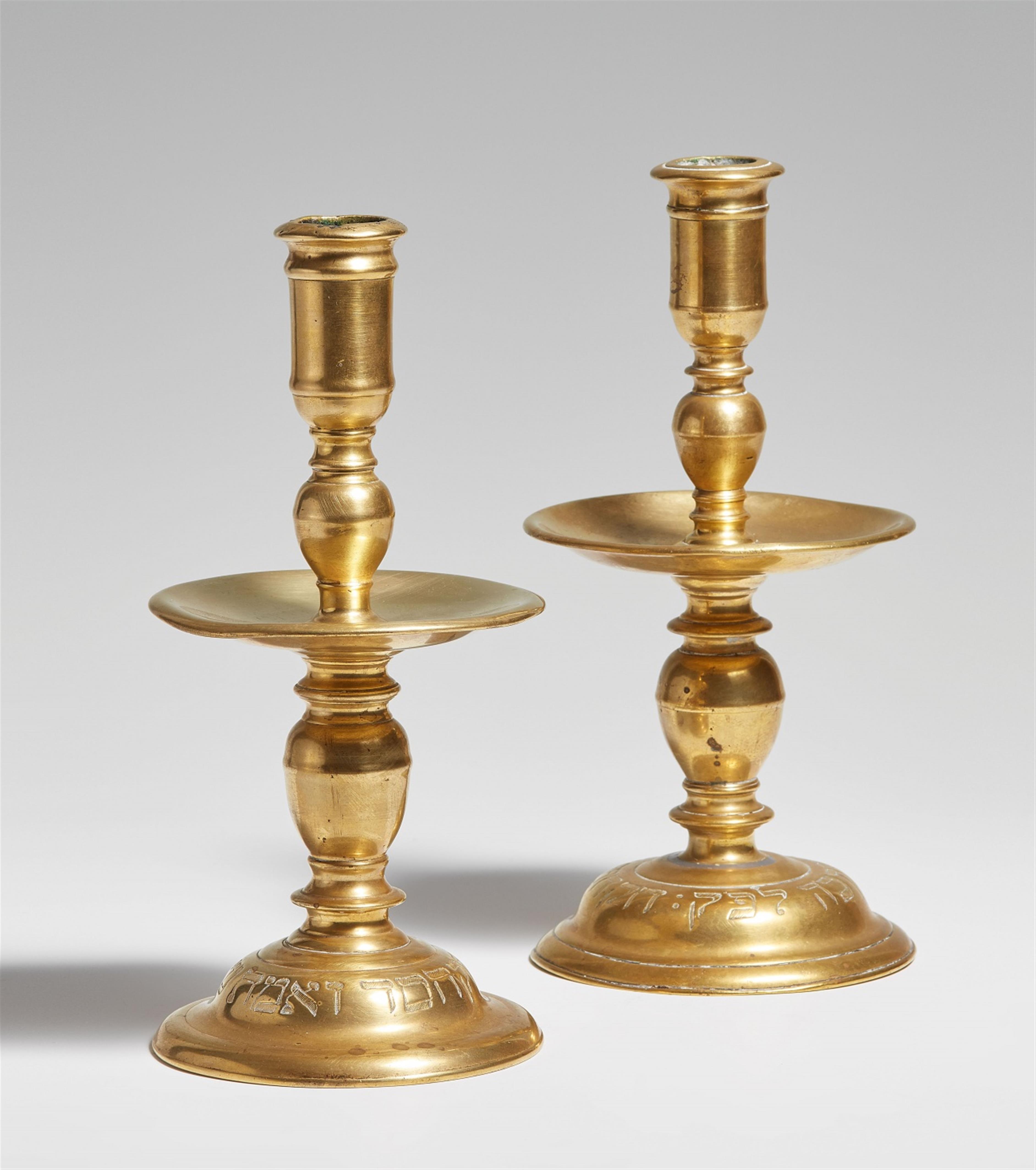 Two brass candlesticks with Hebrew inscriptions - image-1