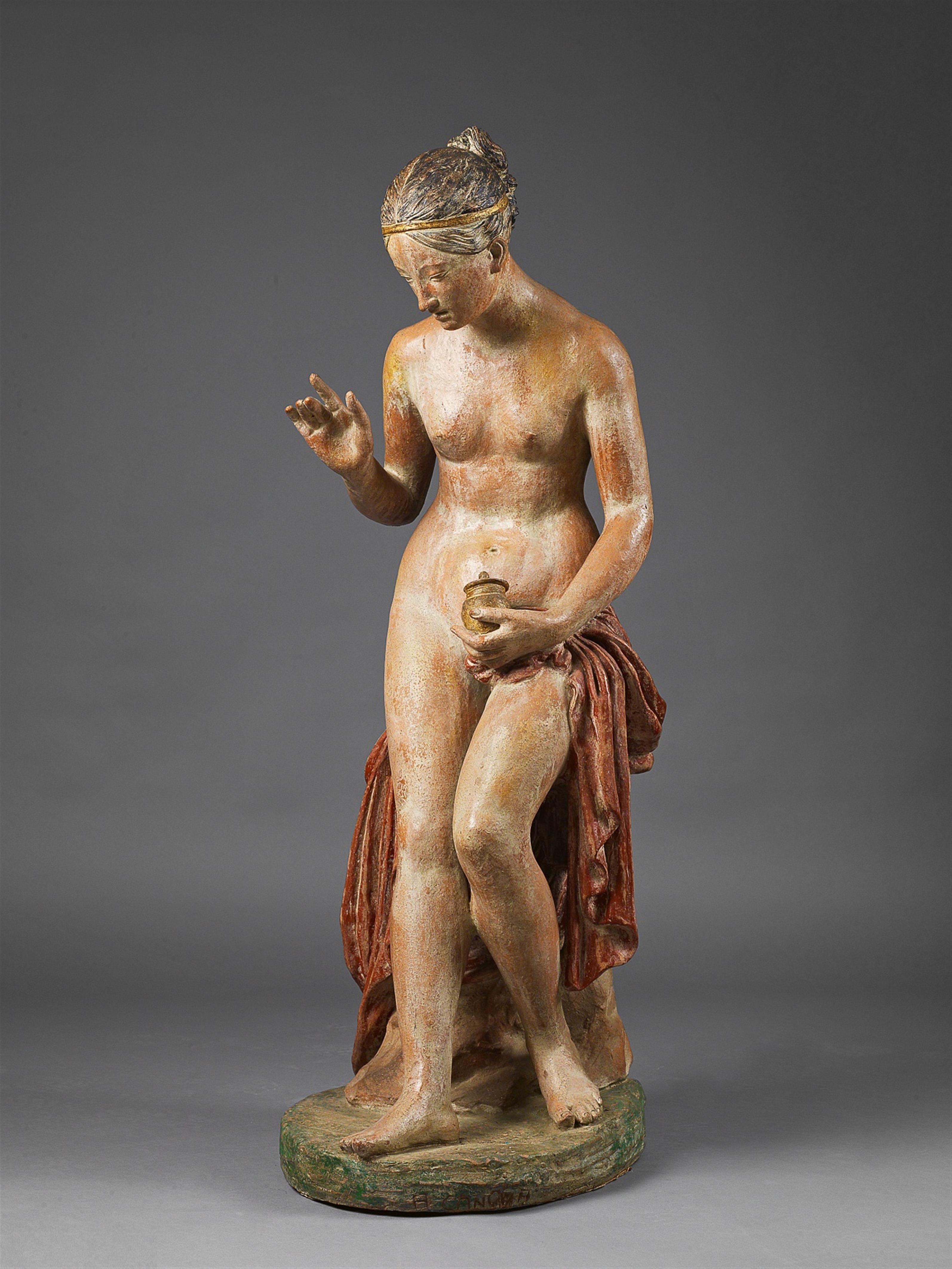 A terracotta figure of a bathing woman - image-1